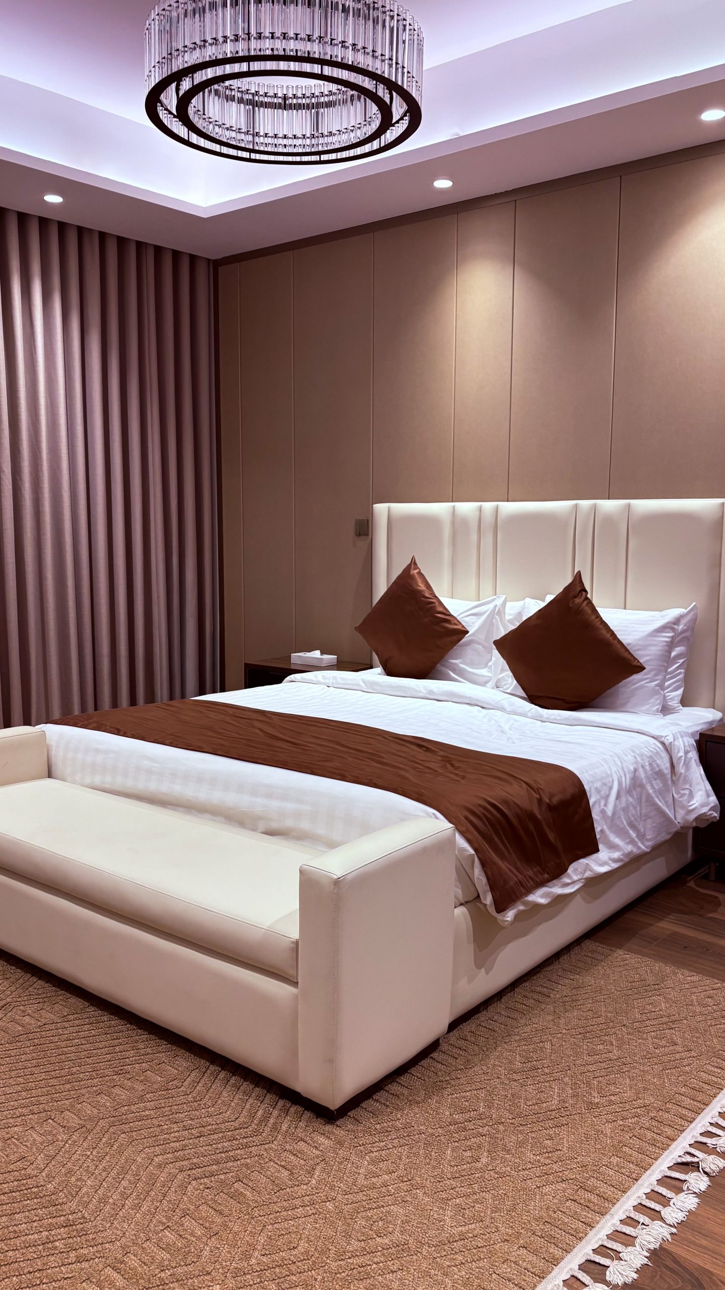 Sophisticated bedroom interior featuring elegant design and ambient lighting.