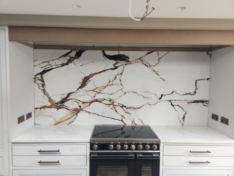 Statement in Stone: Marble Slab Installed Behind Kitchen Stove