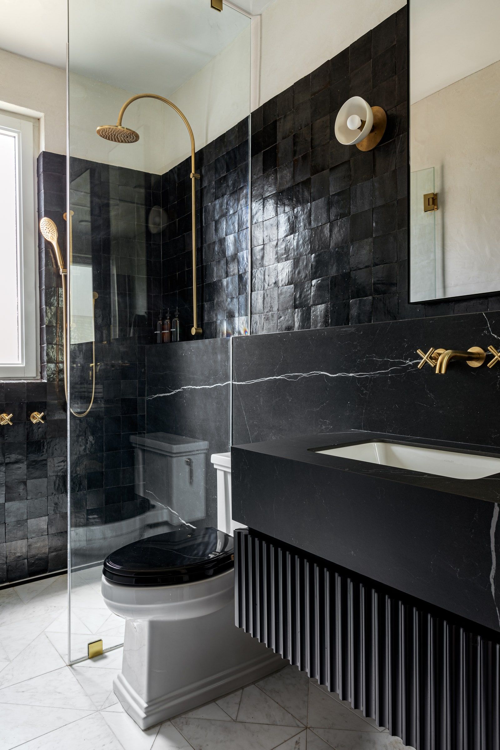 The Moody Black Bathroom Is In—And We're Here for It | Architectural Digest