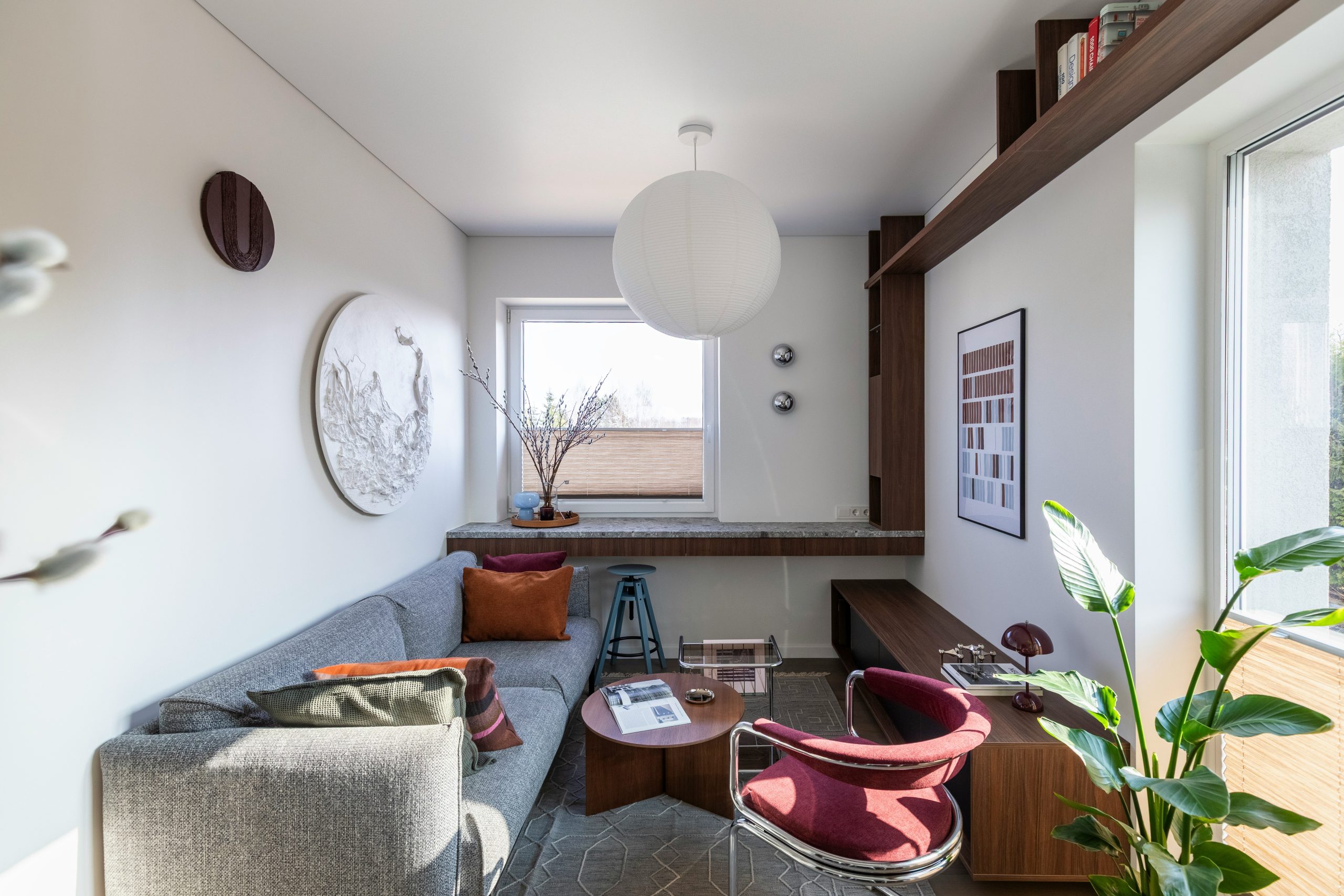 This 35 m² apartment in Vilnius is designed as a compact yet spatially fluid living environment, drawing on Mid-Century modern principles interpreted through a contemporary lens.