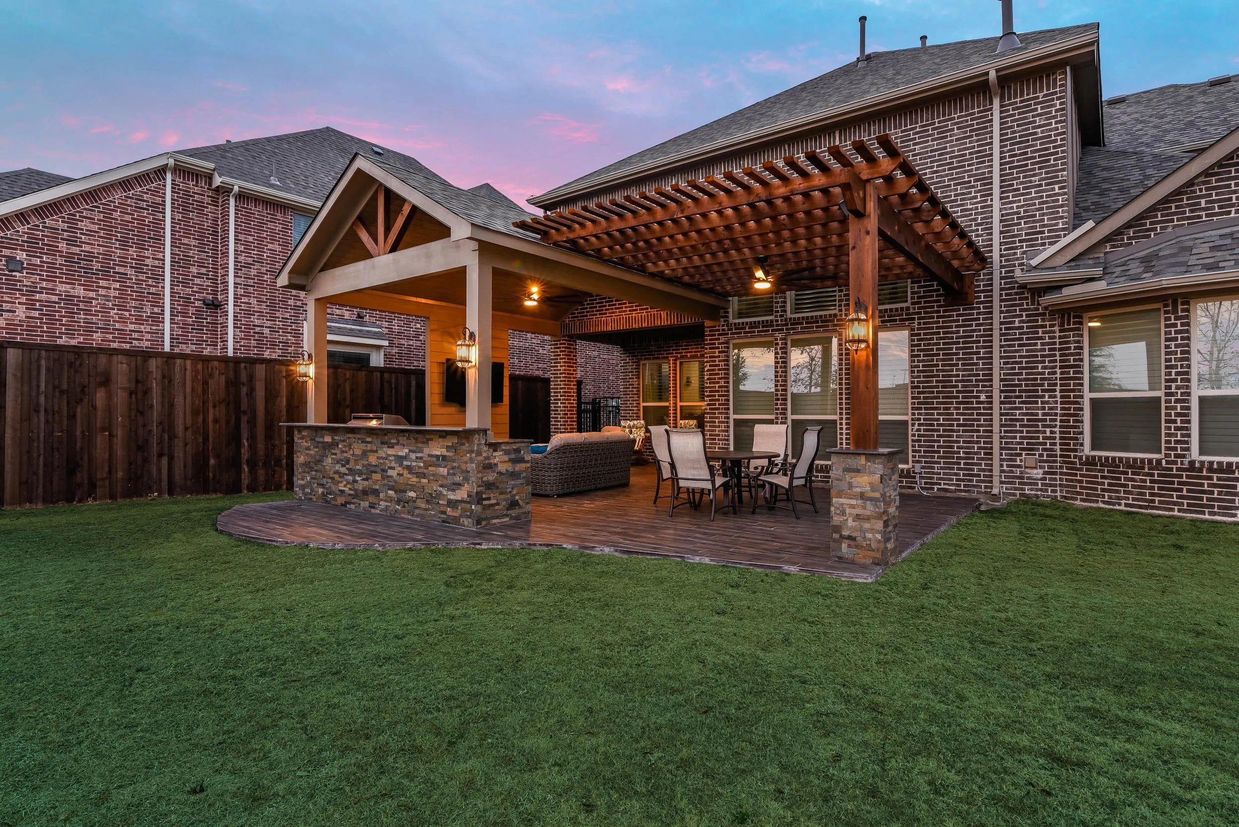 Versatile Outdoor Living Space with Gable Patio Cover, Kitchen, and Pergola in Frisco