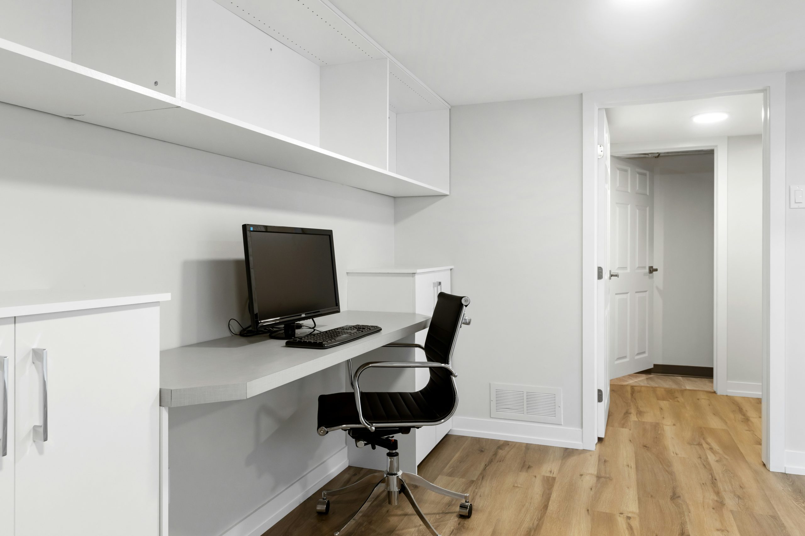 a desk with a computer on top of it