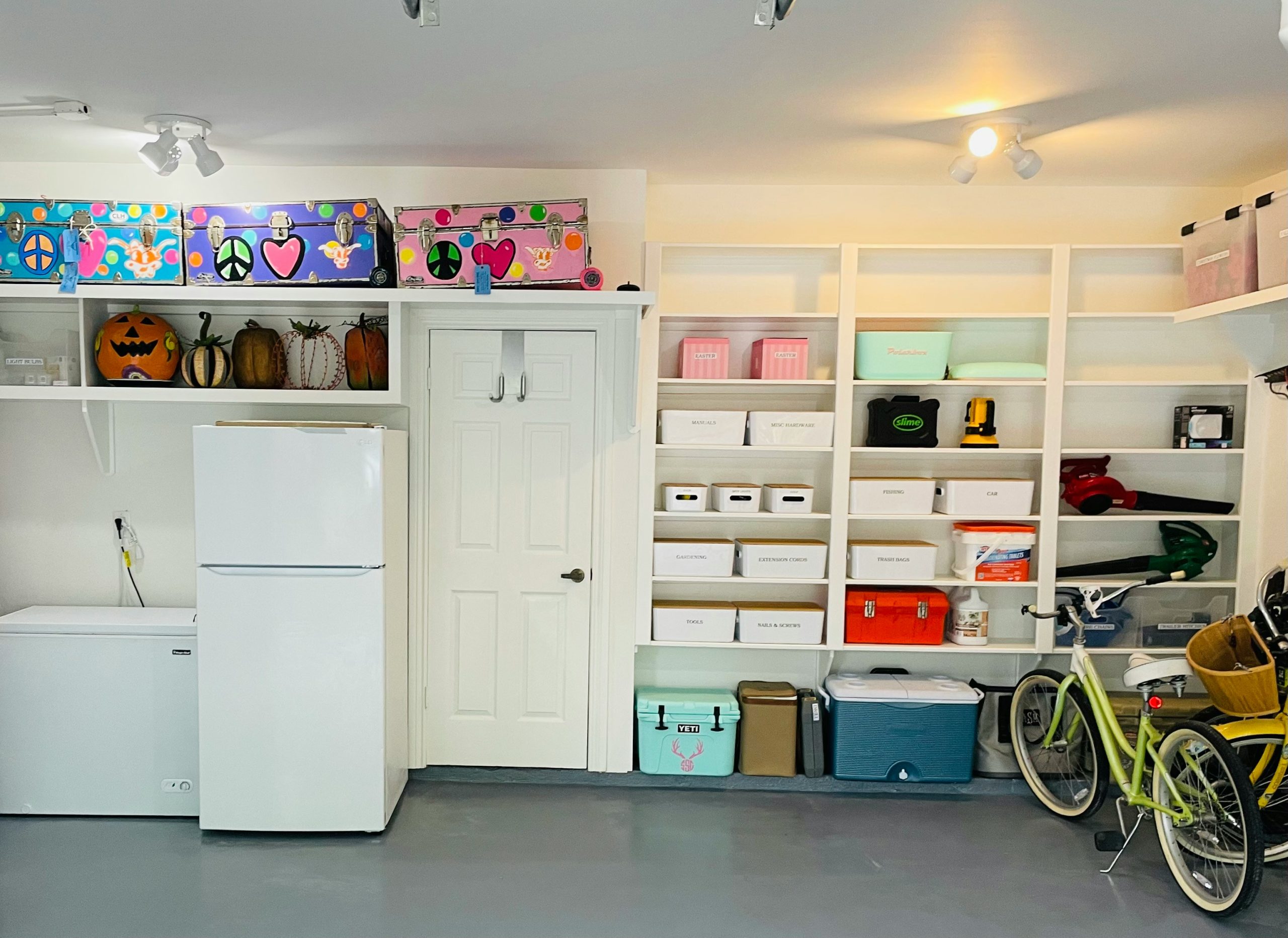 A room filled with lots of white shelves filled with items