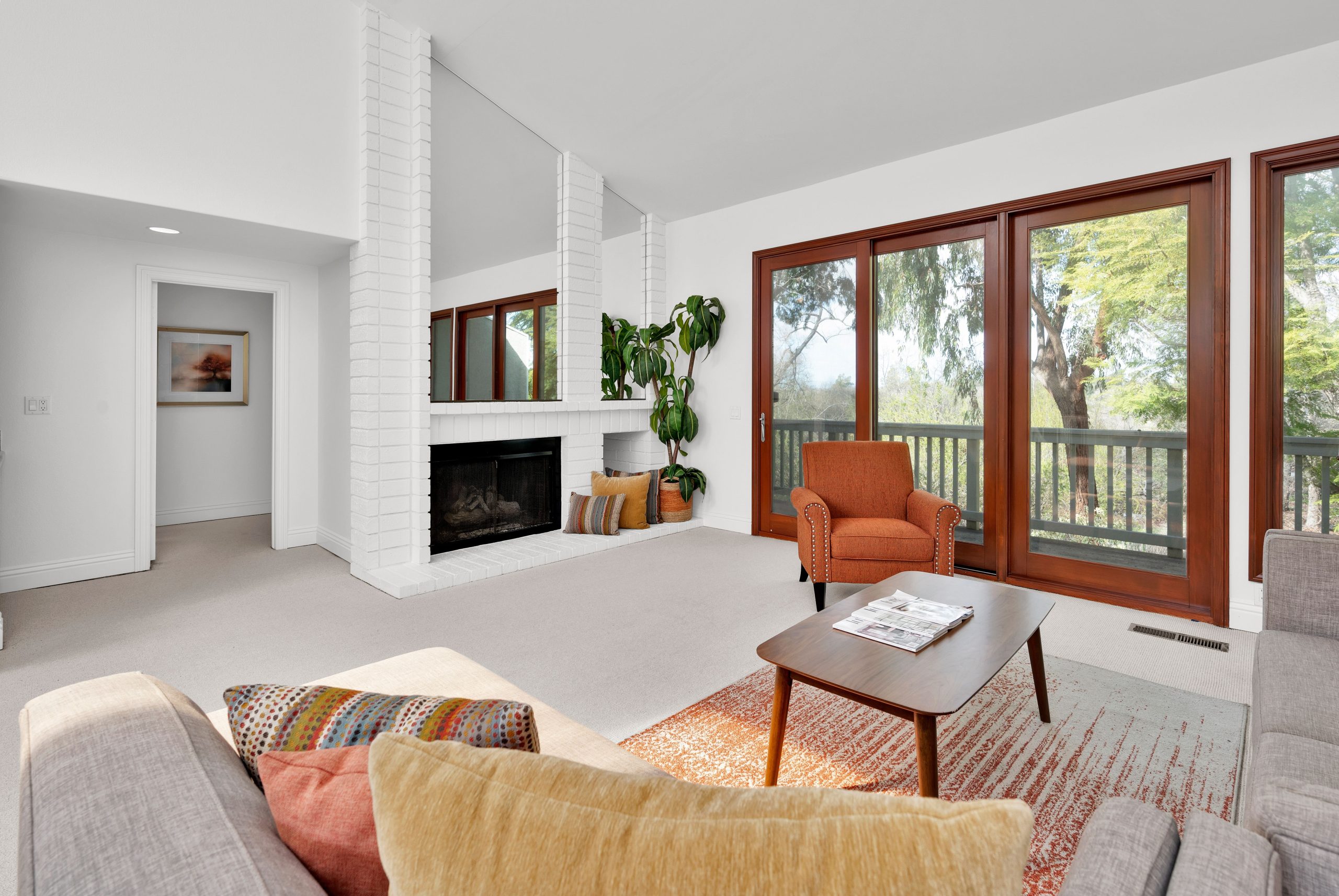Bright living room with modern design, large windows, and cozy seating in Irvine, CA.