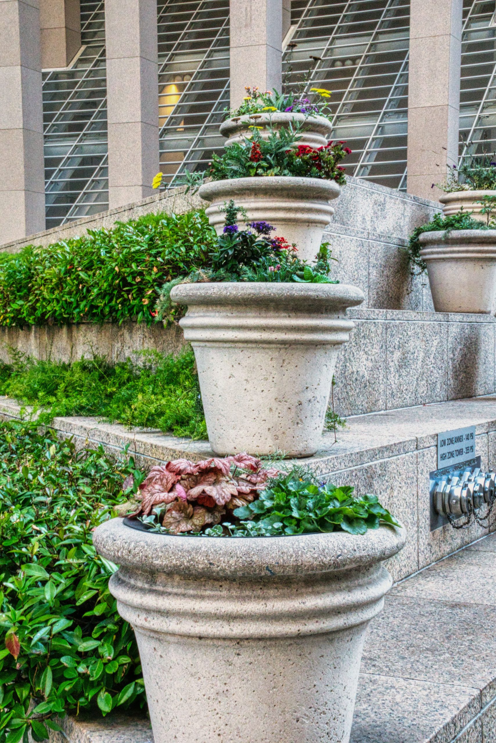 Close-up of tiered plant pots in a modern urban San Francisco setting.