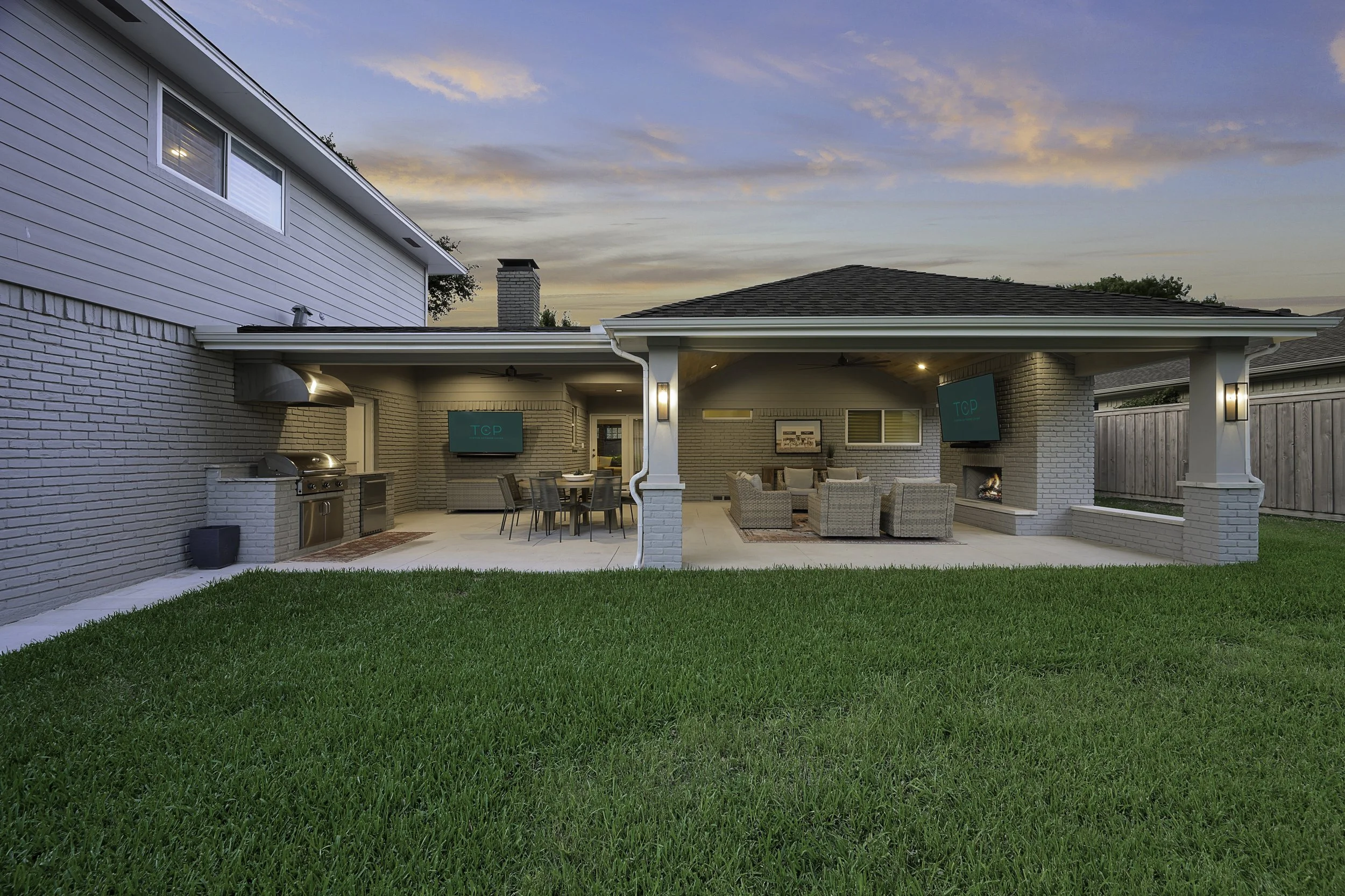Custom Patio Cover with Outdoor Kitchen and Fireplace in Dallas by TCP Looks Original to the Home