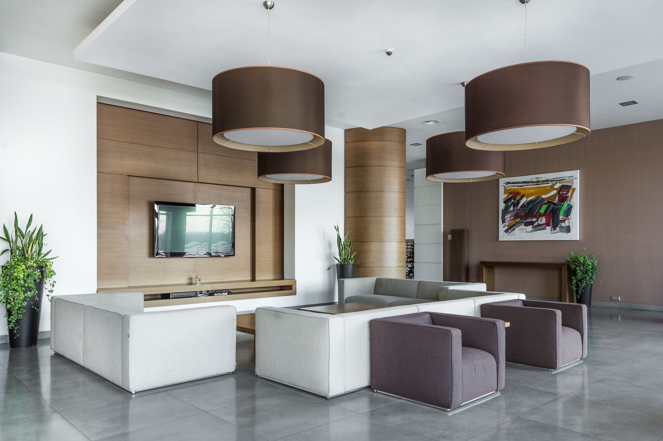 Interior of modern living room in spacious hall of contemporary apartment with comfortable furniture