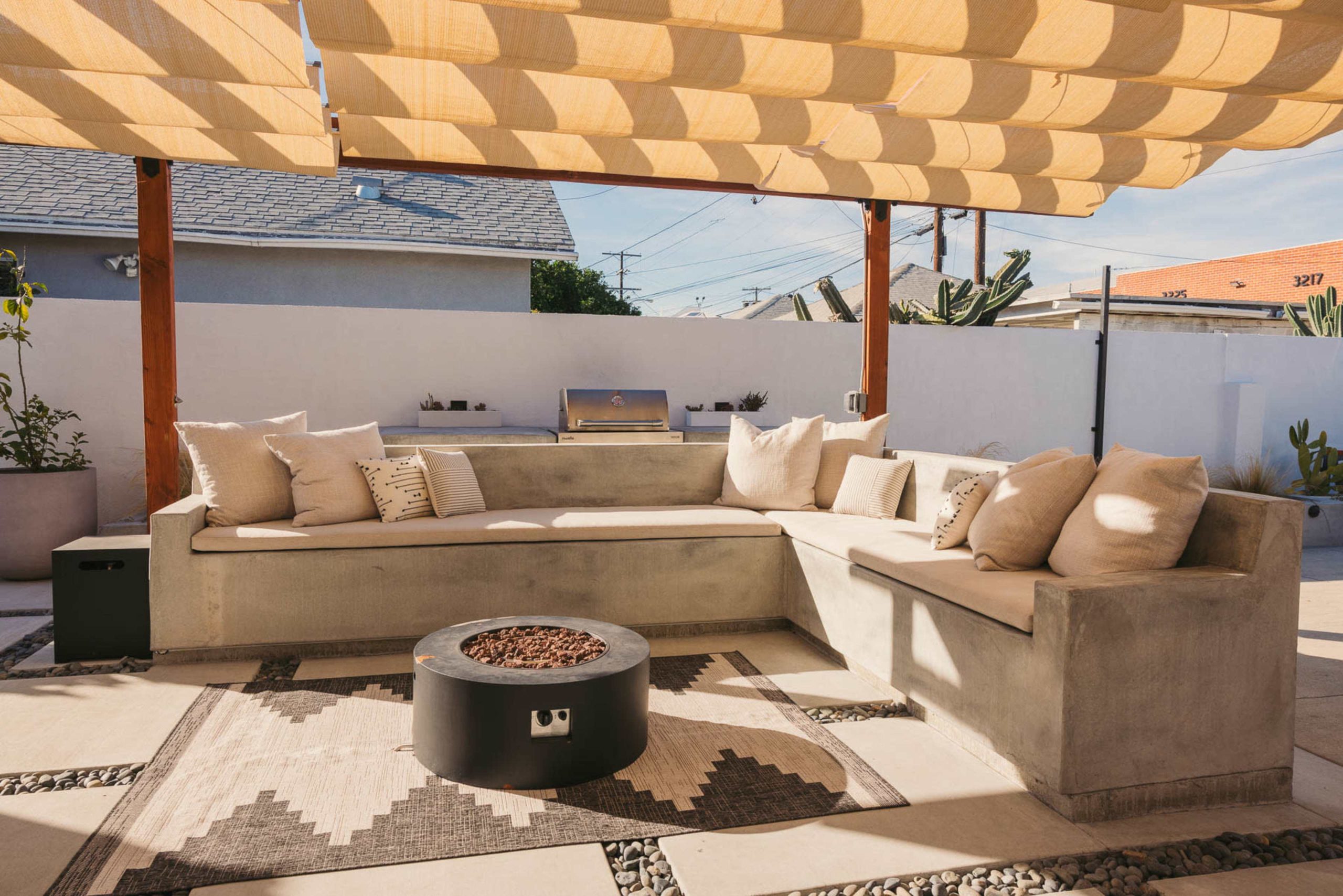 Modern Patio space | Concrete hardscape | Built in grill top & fire pit, Los Angeles, CA | Production | Peerspace