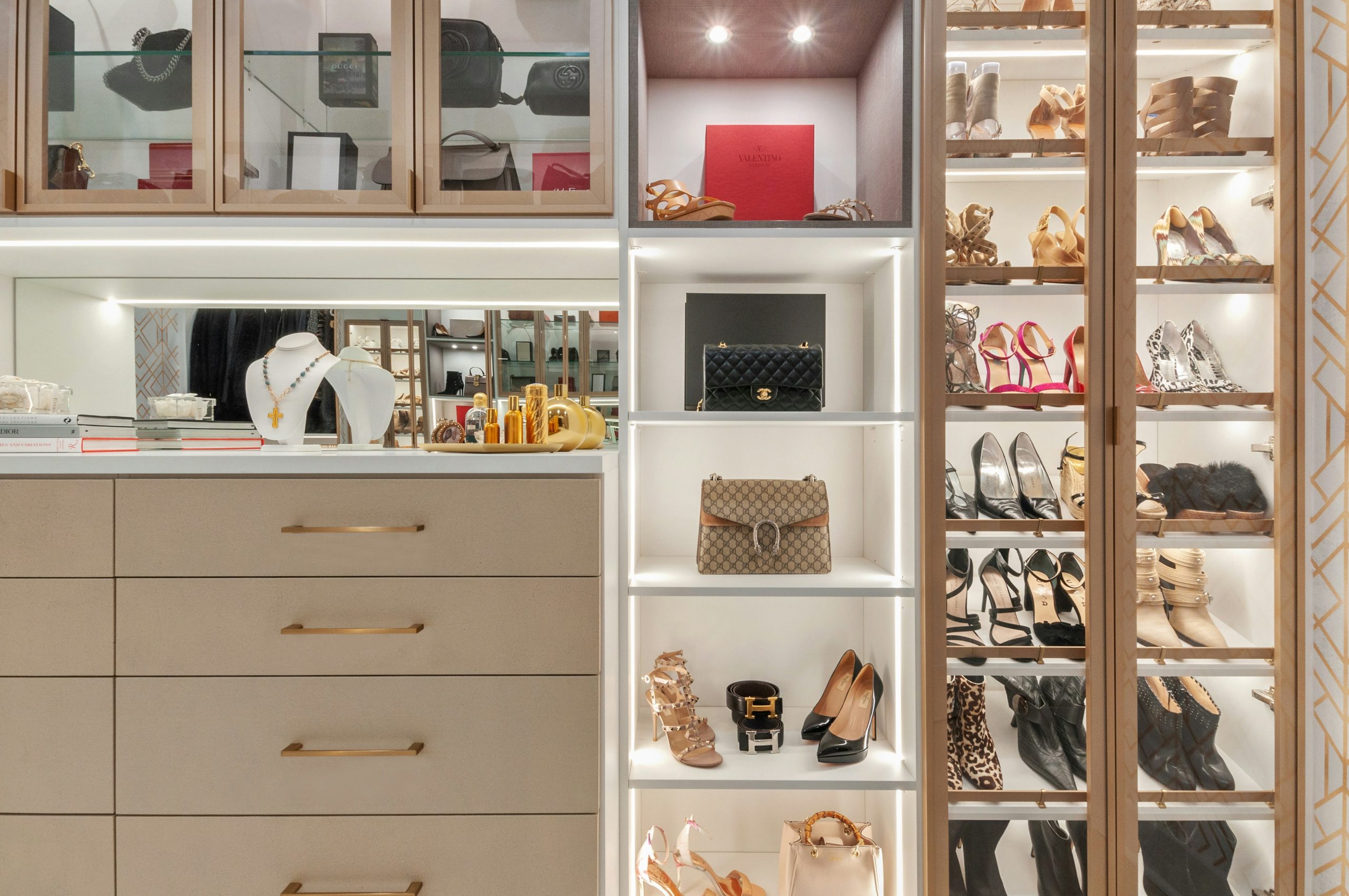 no expense was spared in this custom closet build out in a gorgeous nj home