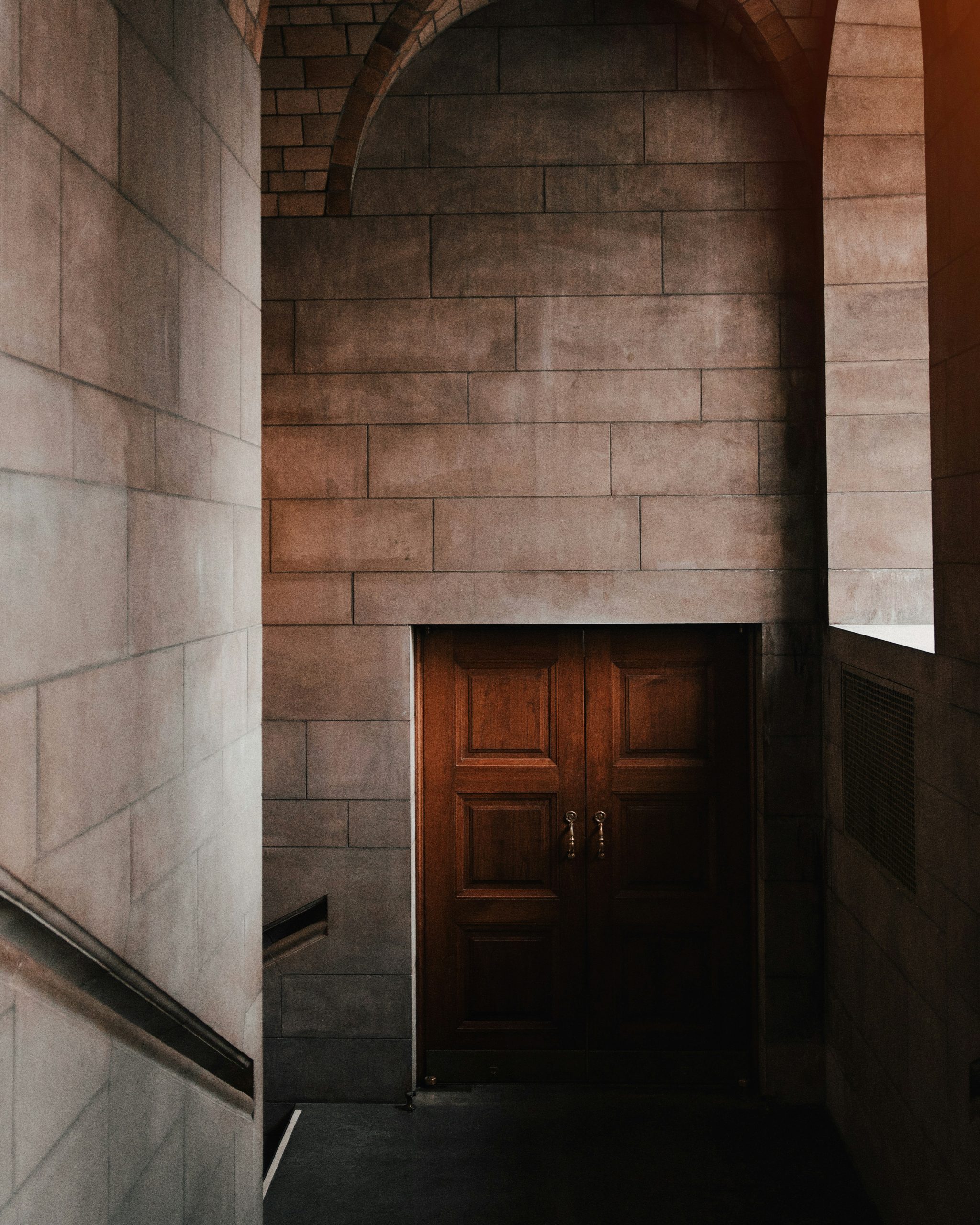stairs towards brown wooden door
