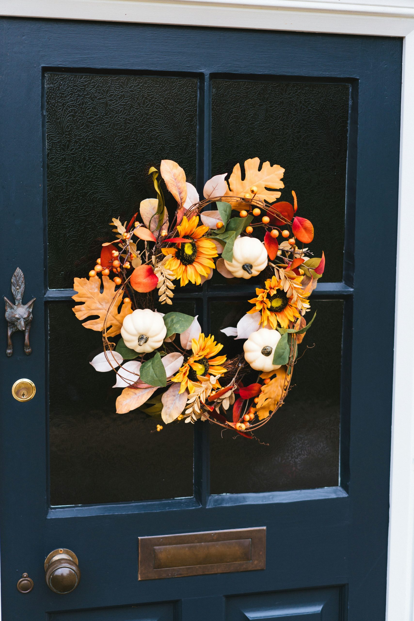 A blue door with a wreath on it