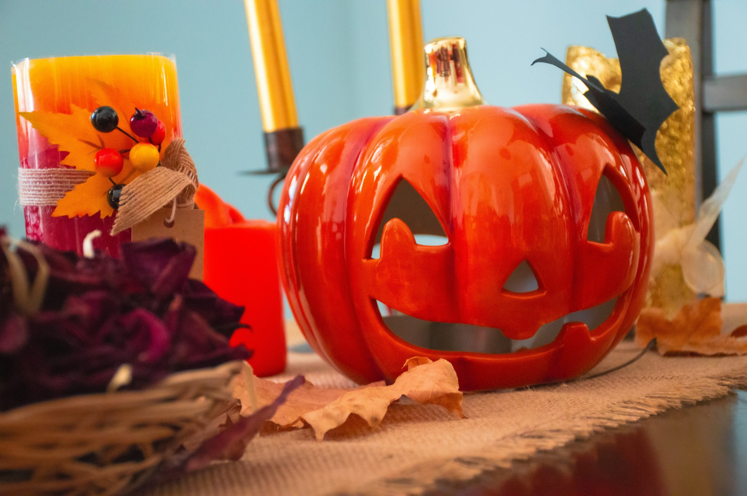 a pumpkin sitting on top of a table next to candles