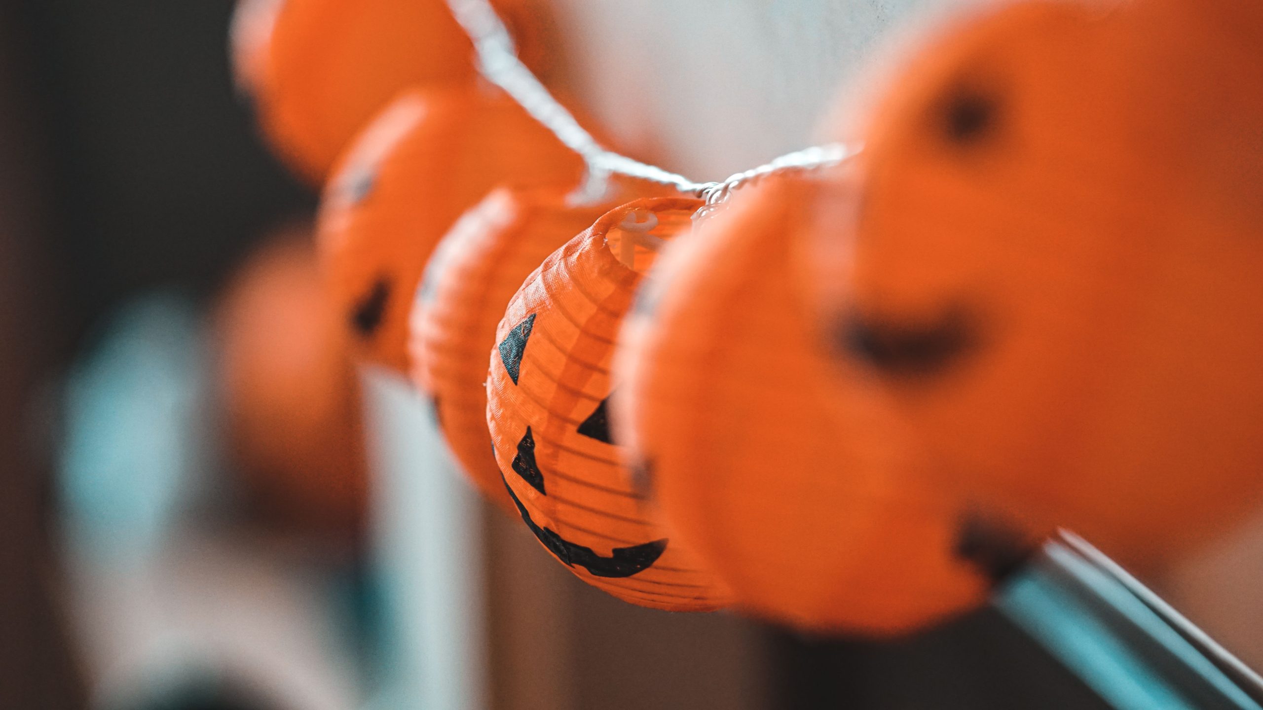 Close-up of decorative orange Halloween pumpkin lanterns. Perfect for festive atmosphere.