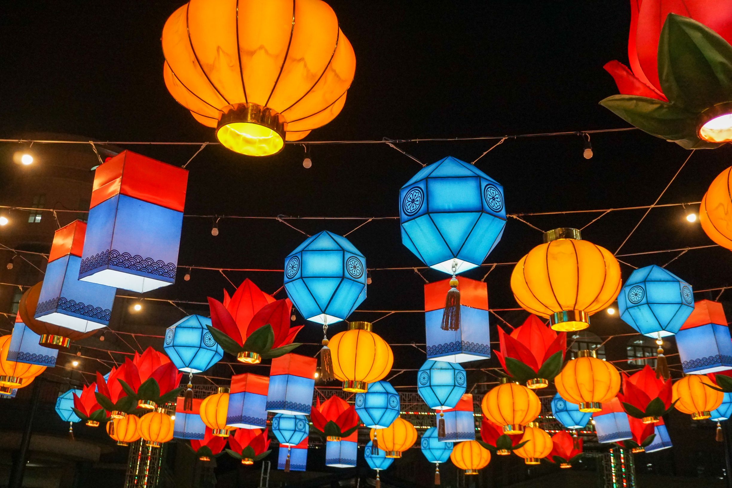 Colorful lanterns create a festive atmosphere at night, perfect for celebrations.