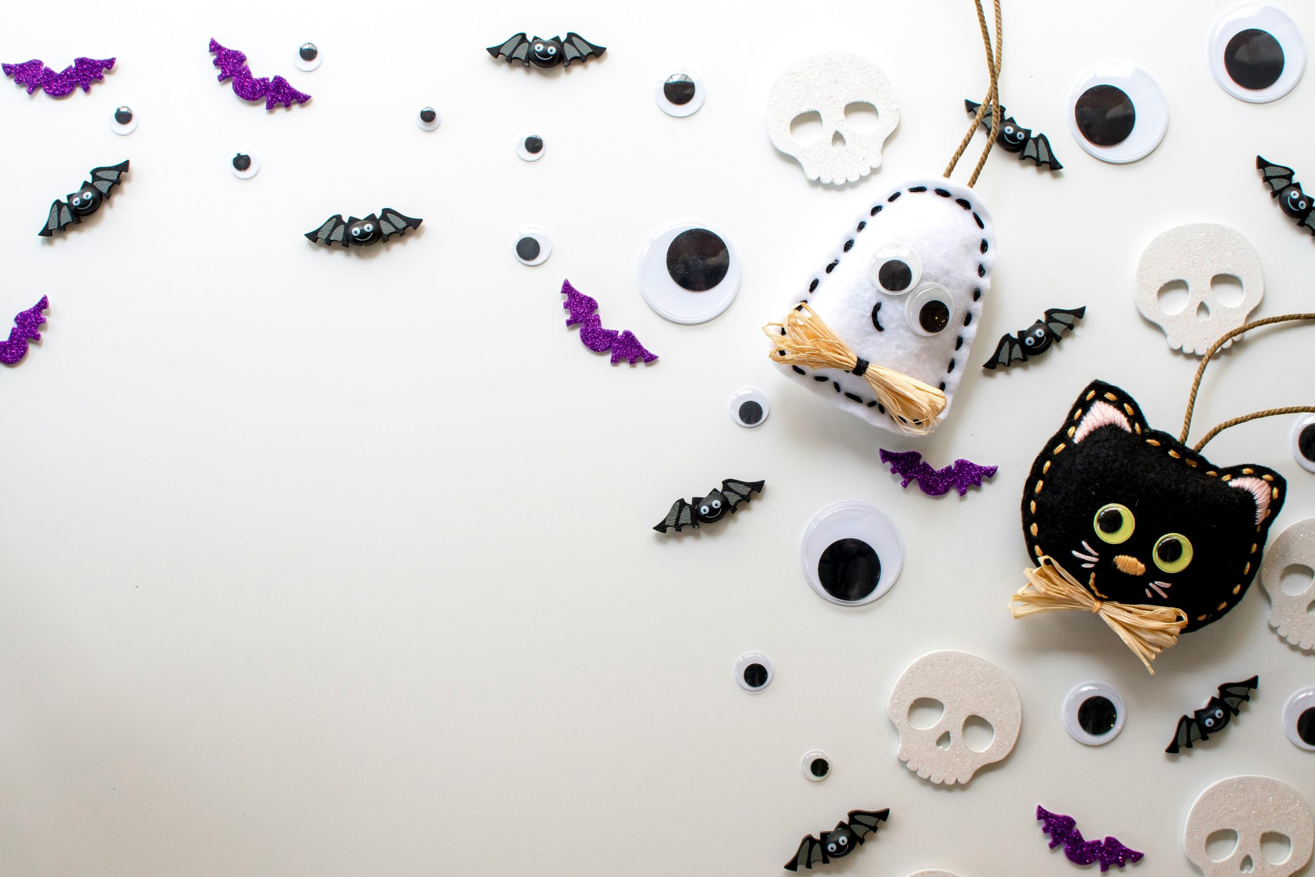 Cute Black Cat & Ghost with Eyes, Skulls, & Bats Halloween Background