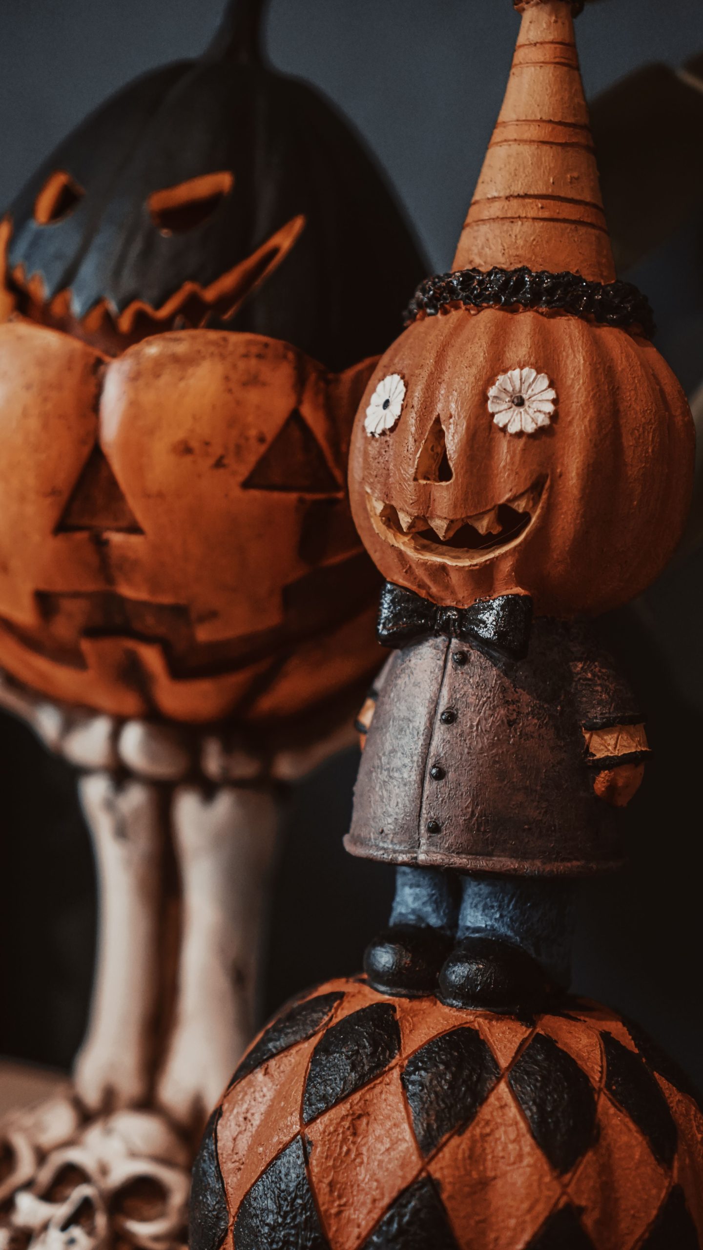 Decorative Halloween pumpkins with playful expressions showcasing a festive and spooky atmosphere.