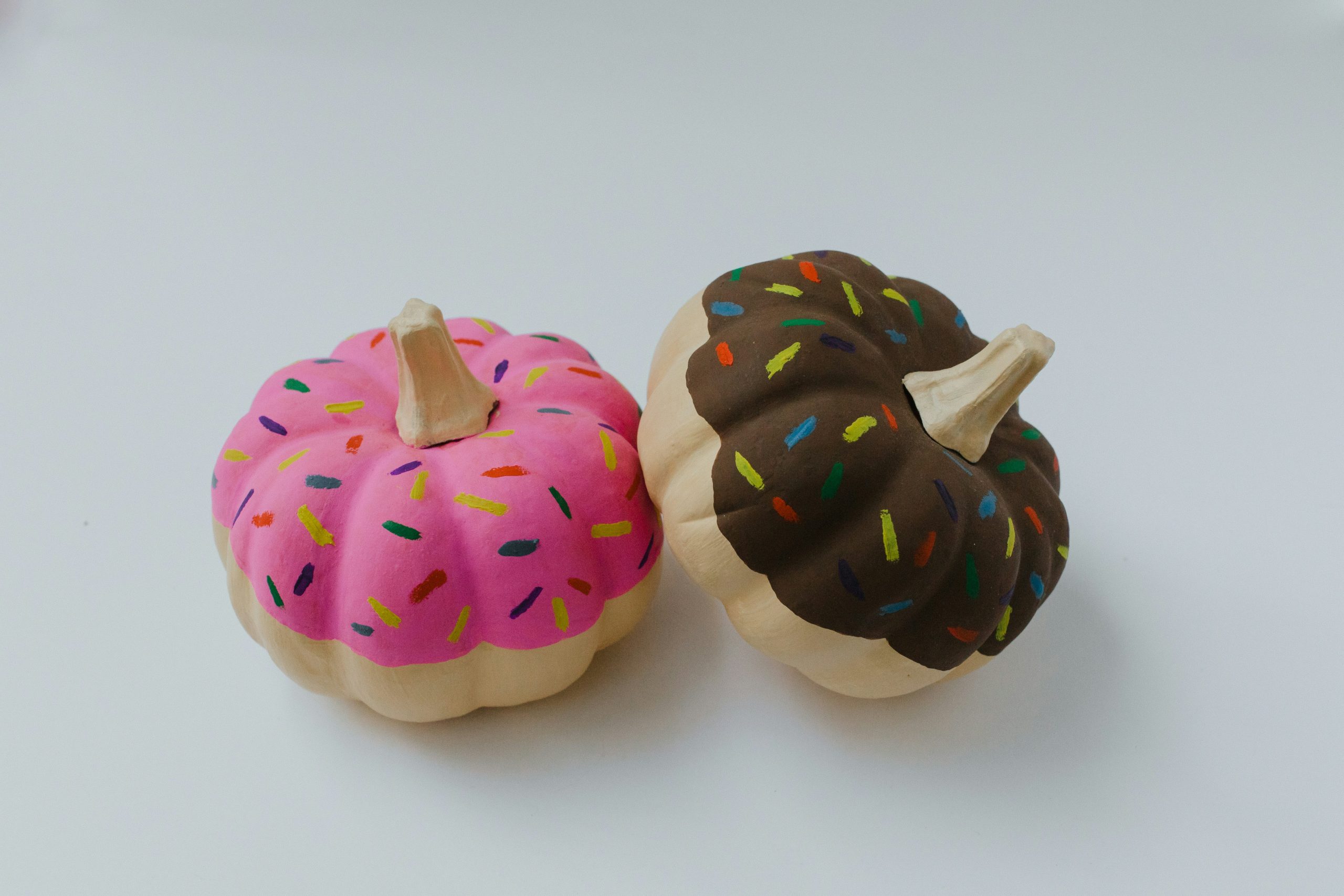 Pumpkins painted like doughnuts