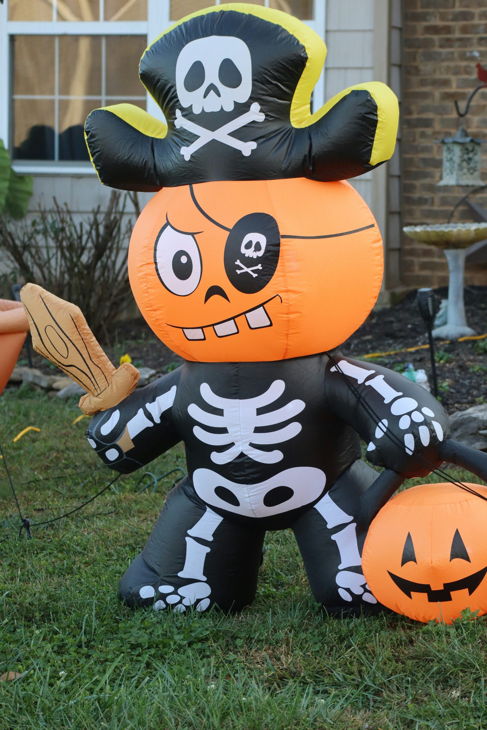 This cutie stands spooky guard over a lawn on Halloween.
