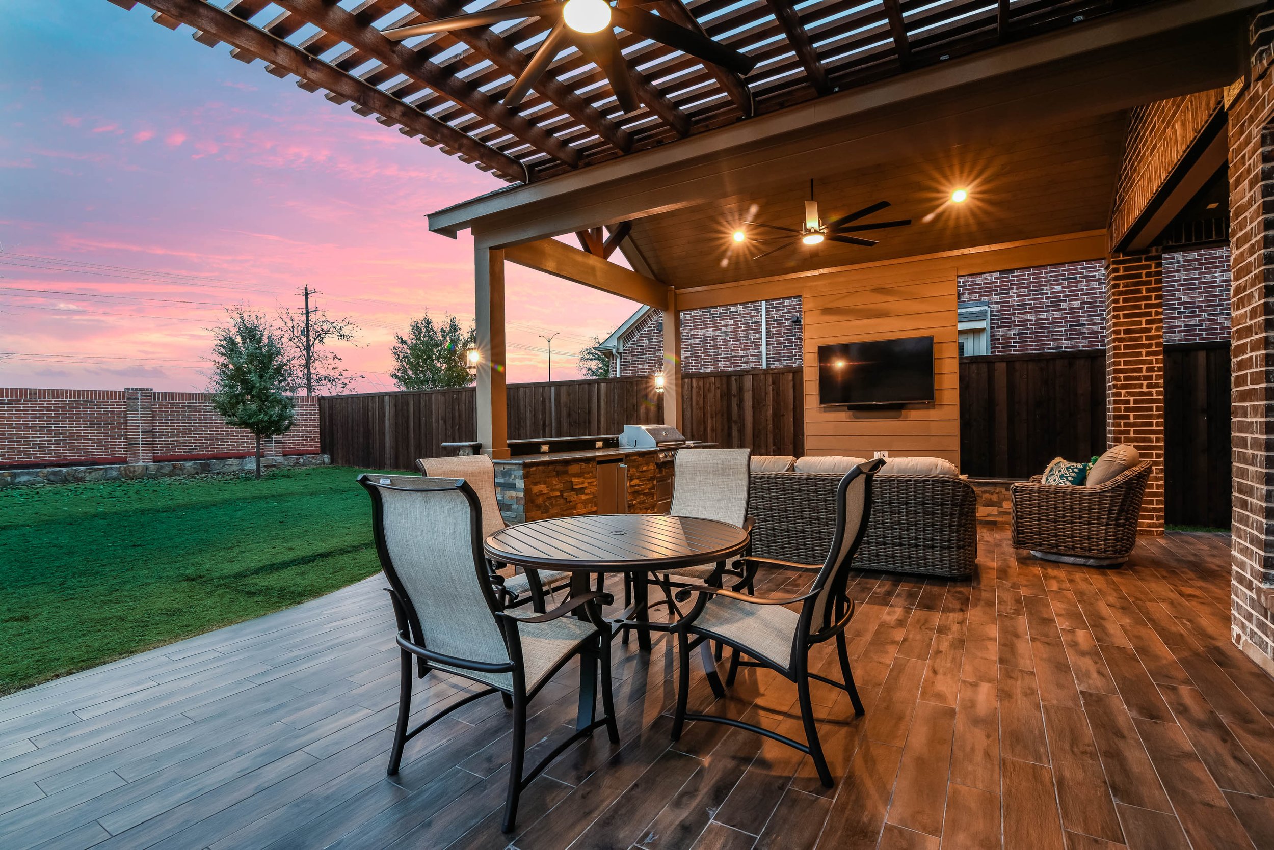 Versatile Outdoor Living Space with Gable Patio Cover, Kitchen, and Pergola in Frisco