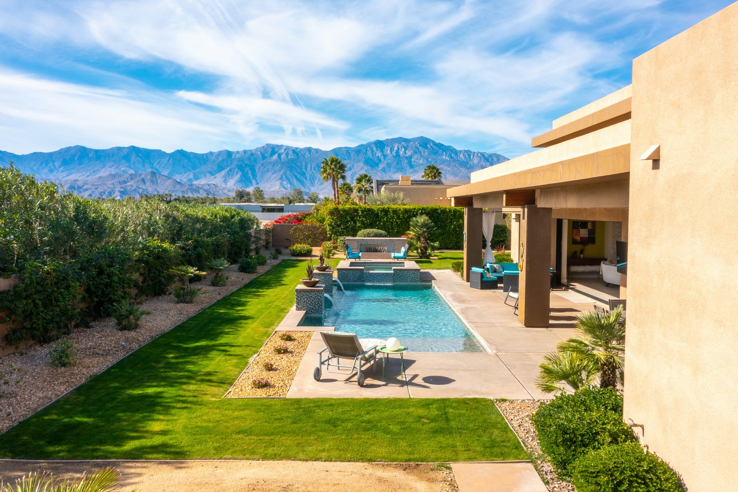 a backyard with a pool and a patio