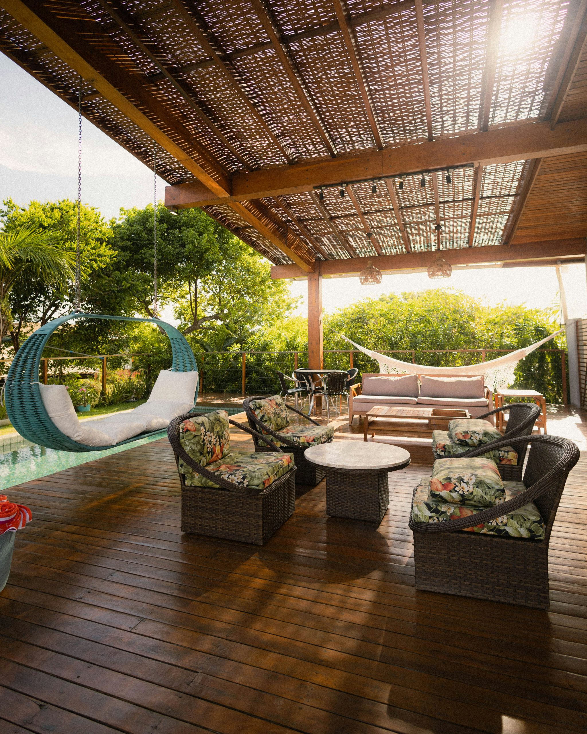 A beautiful patio with seating and a swing