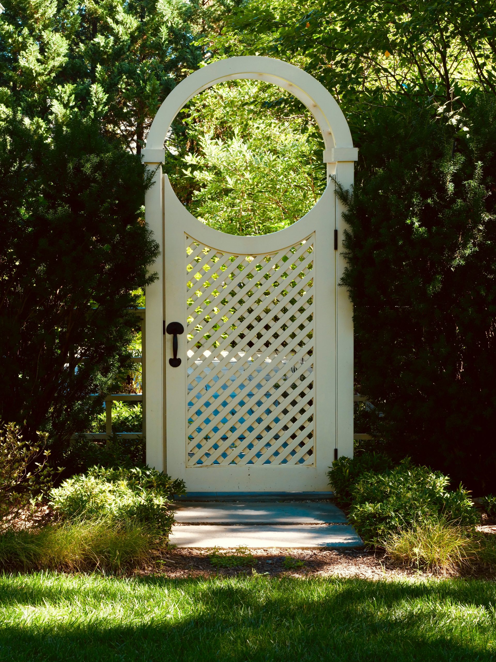 A garden gate with a circle top