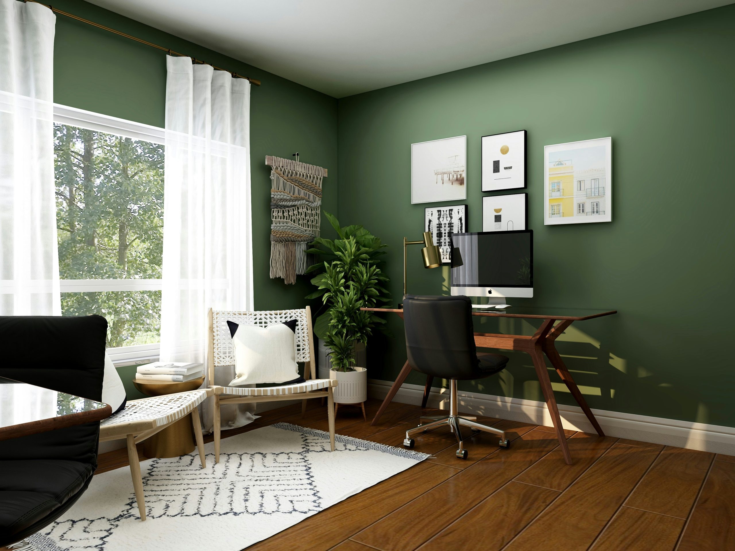 A home office with a wooden desk, black chair, and green walls