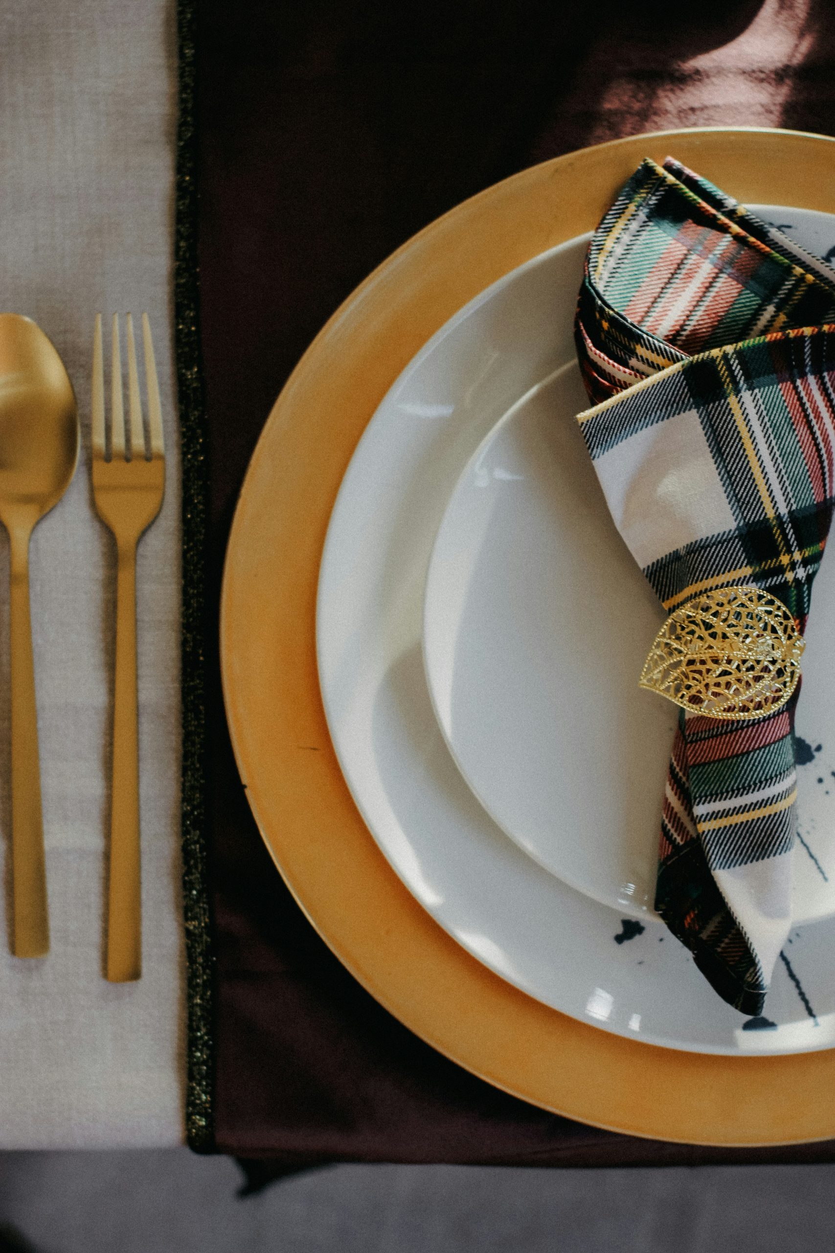 a place setting with a napkin, fork and knife