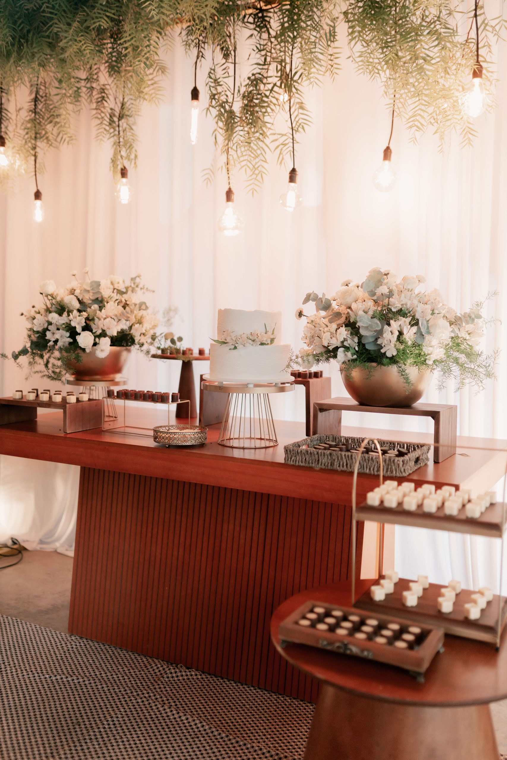 Beautifully arranged wedding reception table with floral decor and ambient lighting, perfect for elegant celebrations.