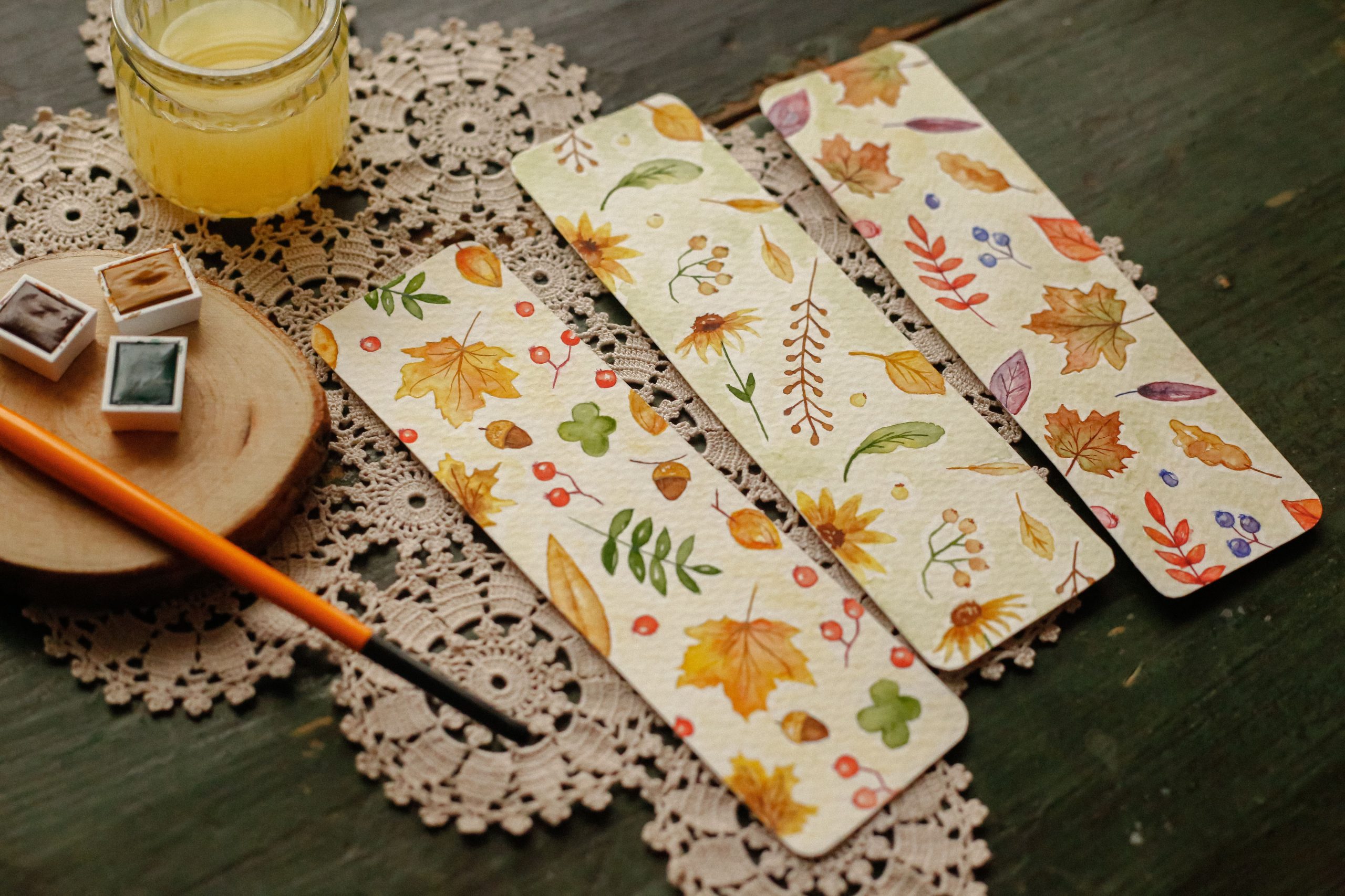 Charming handmade bookmarks featuring autumn watercolor designs, perfect for book lovers.