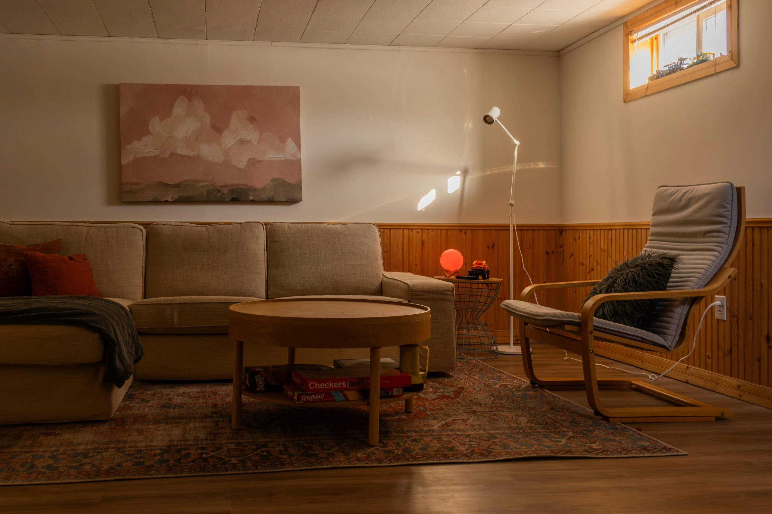 Cozy living room with sectional couch and armchair