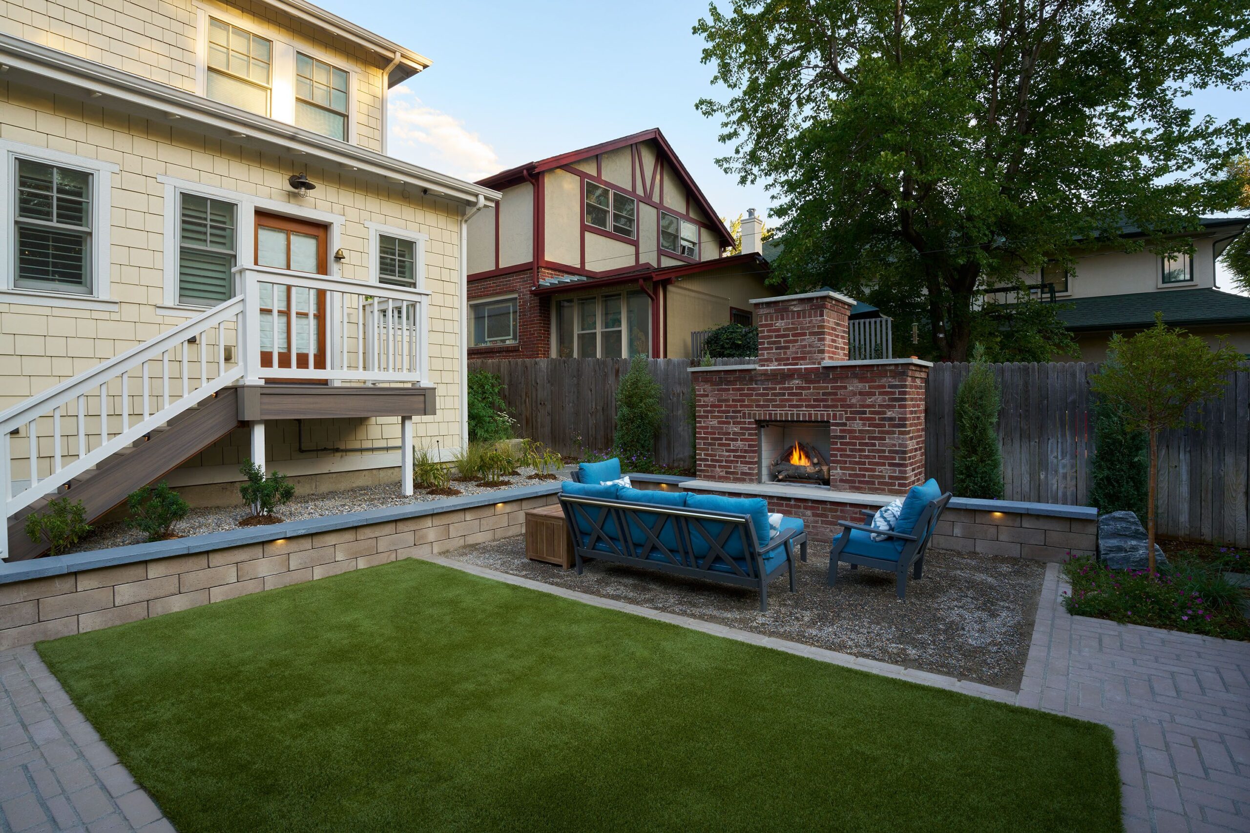 Create a Cozy Backyard Retreat With a Deck Builder and Outdoor Fireplace in Lone Tree, CO – Down to Earth Landscaping Co.