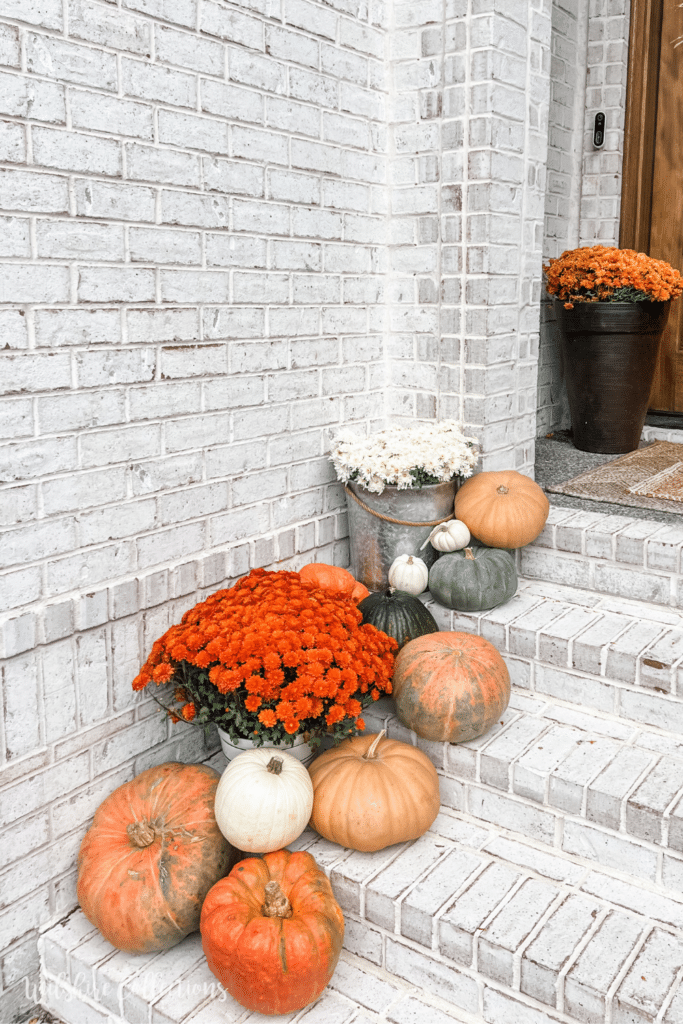 Fall front porch with cascading pumpkins - Wilshire Collections