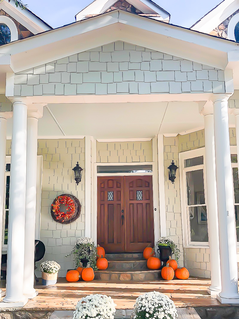 Fall front porch with orange and gray accents - Duke Manor Farm by Laura Janning