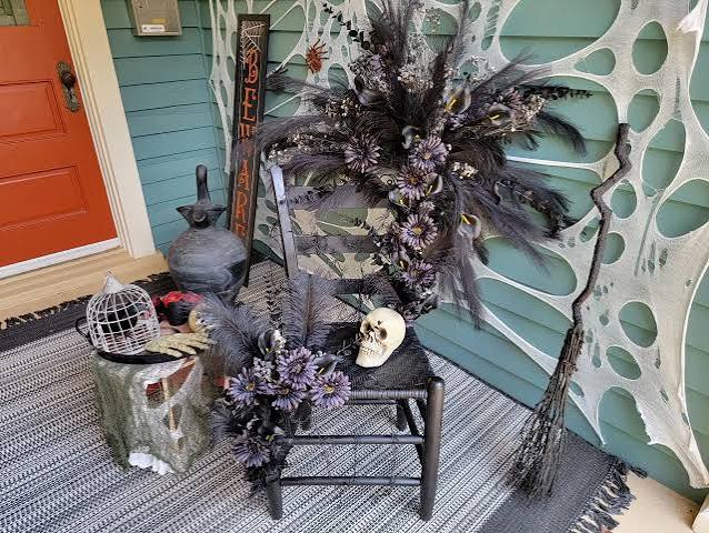 Halloween Front Porch Decor Idea: Black Gothic Seating With Black Flowers | HGTV
