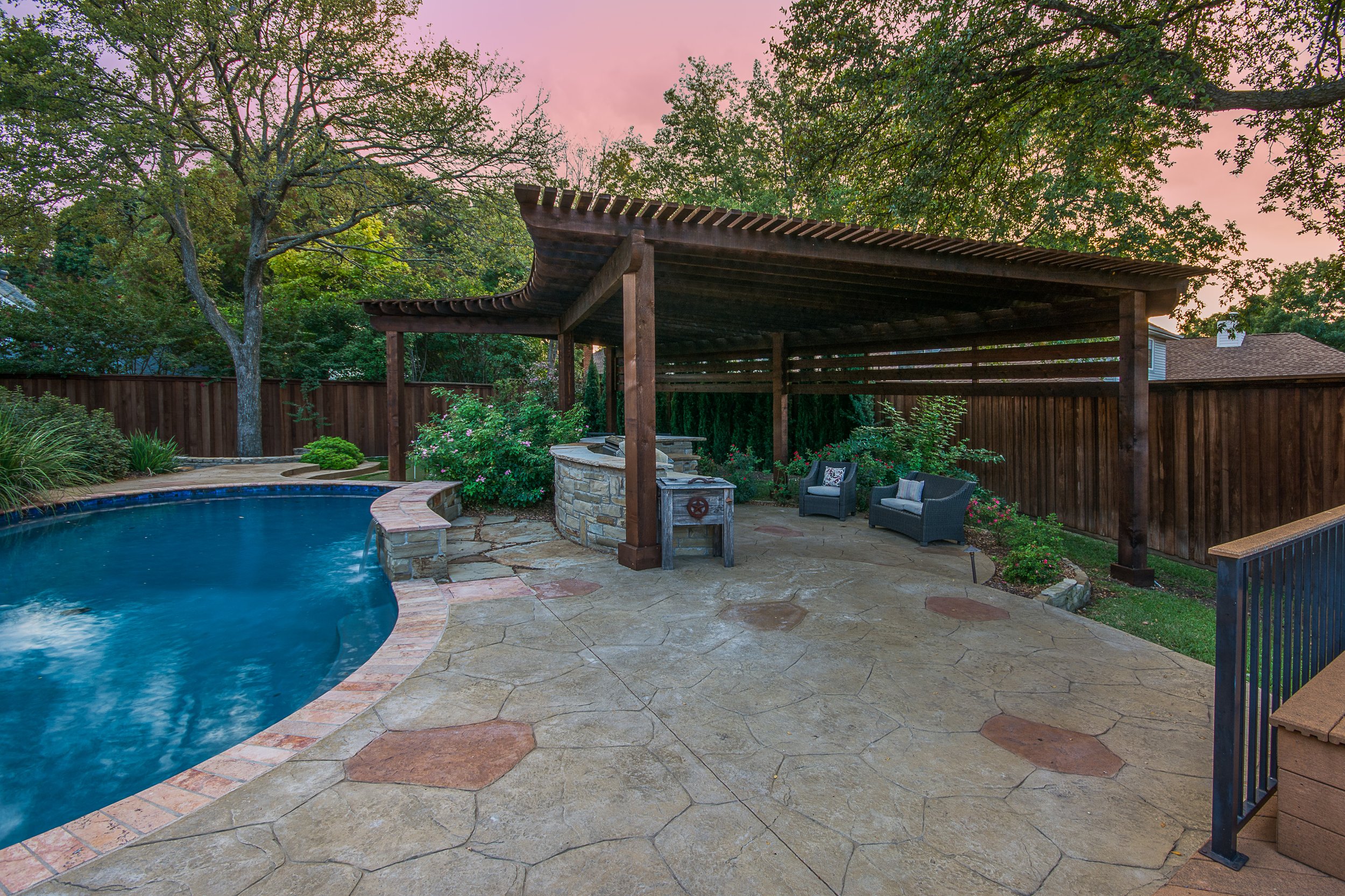 Luxury Poolside Retreat in Farmers Branch with Pergola, Deck, Pool Bar, and Putting Green
