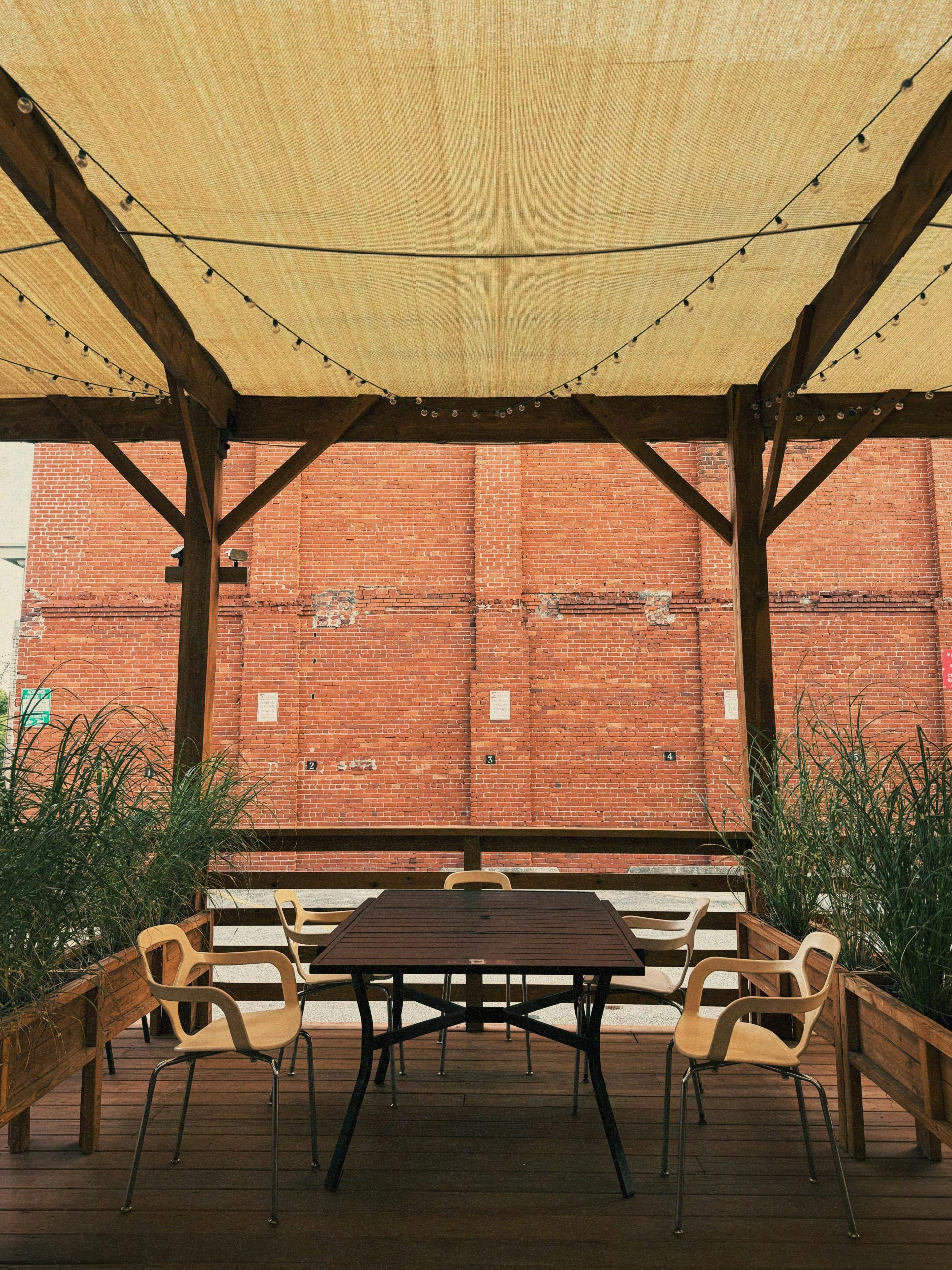 Outdoor seating area with tables and chairs