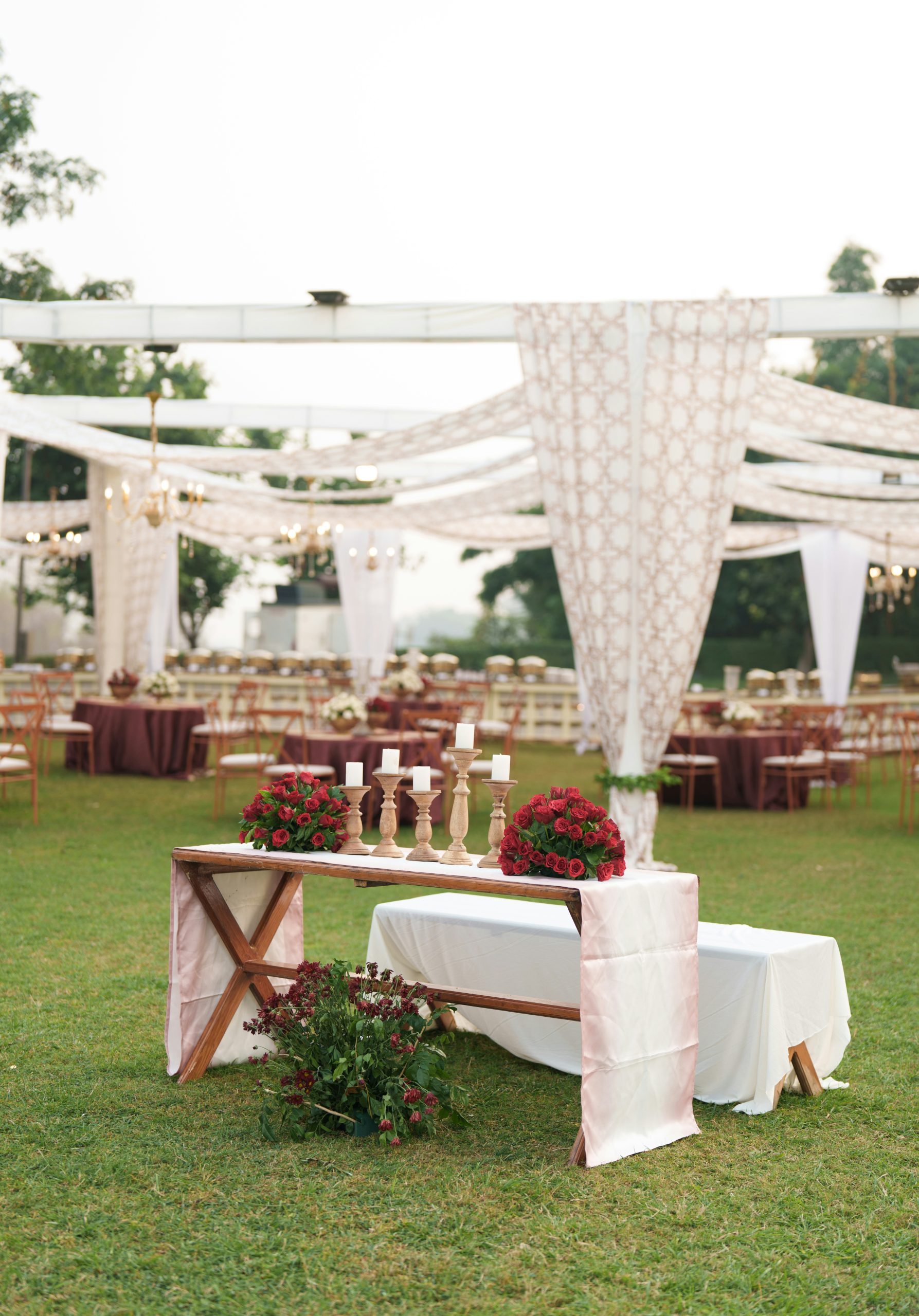 Outdoor wedding reception with elegant table decorations