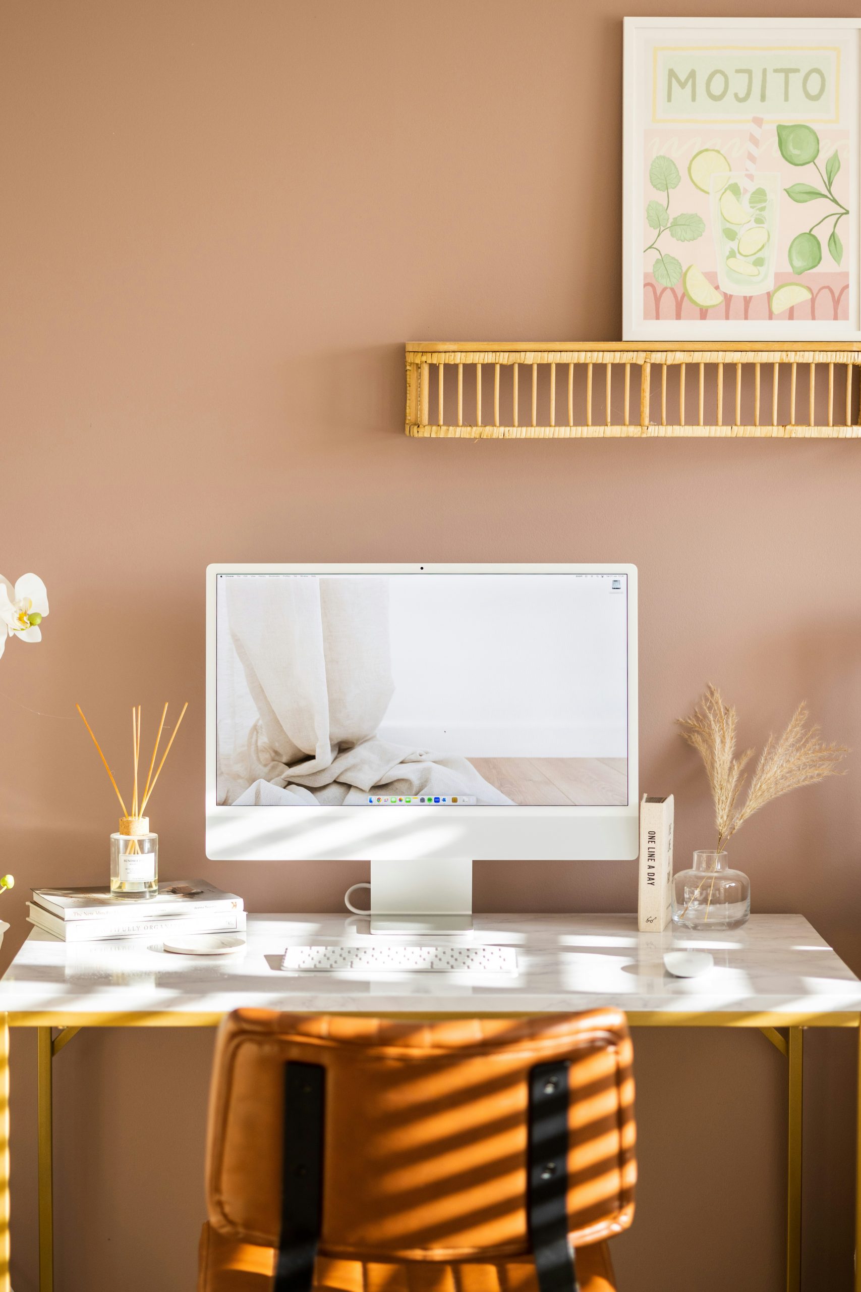 Pink interior design office room and iMac setup.