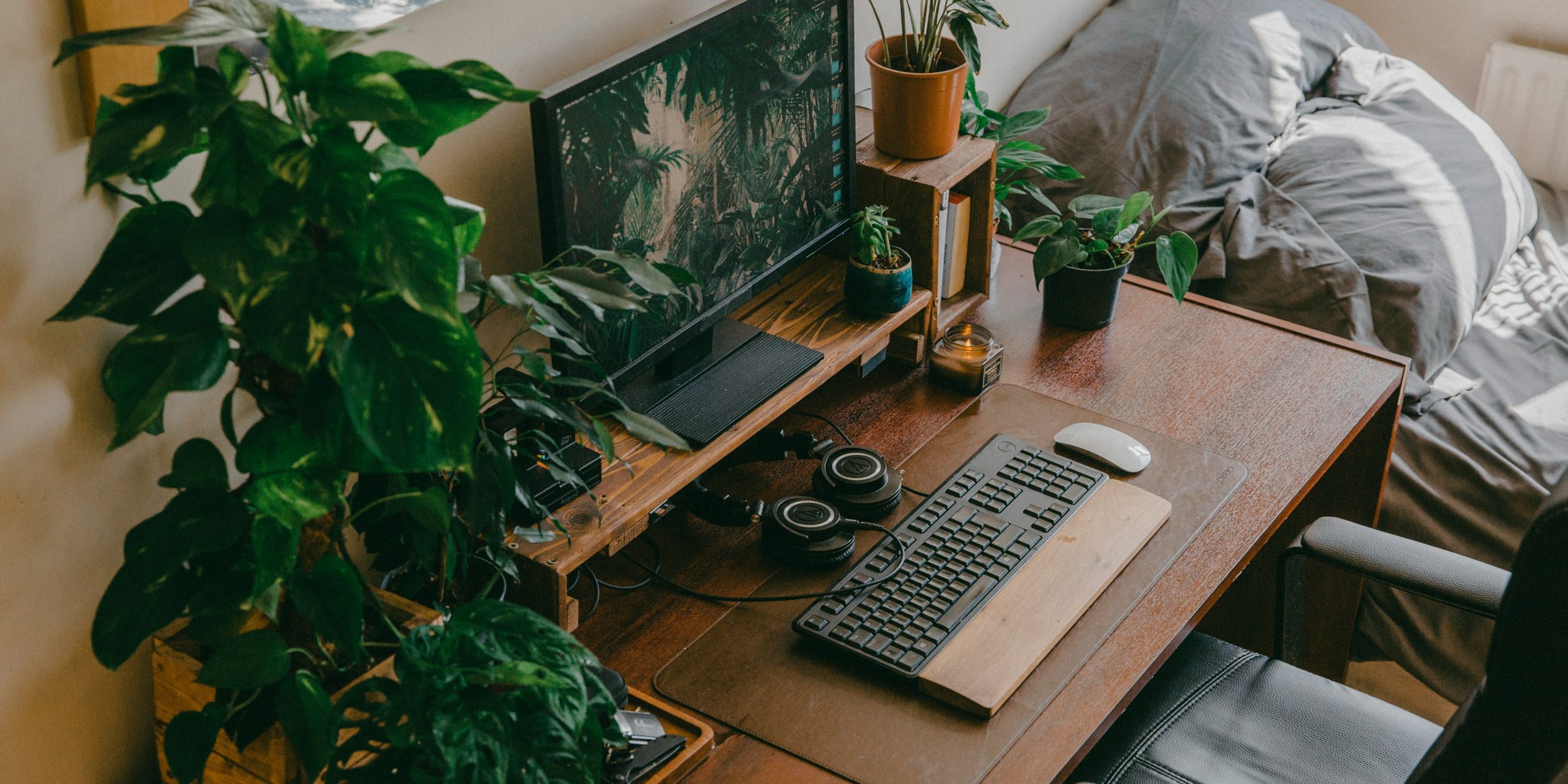silver imac with keyboard and mouse on brown wooden table