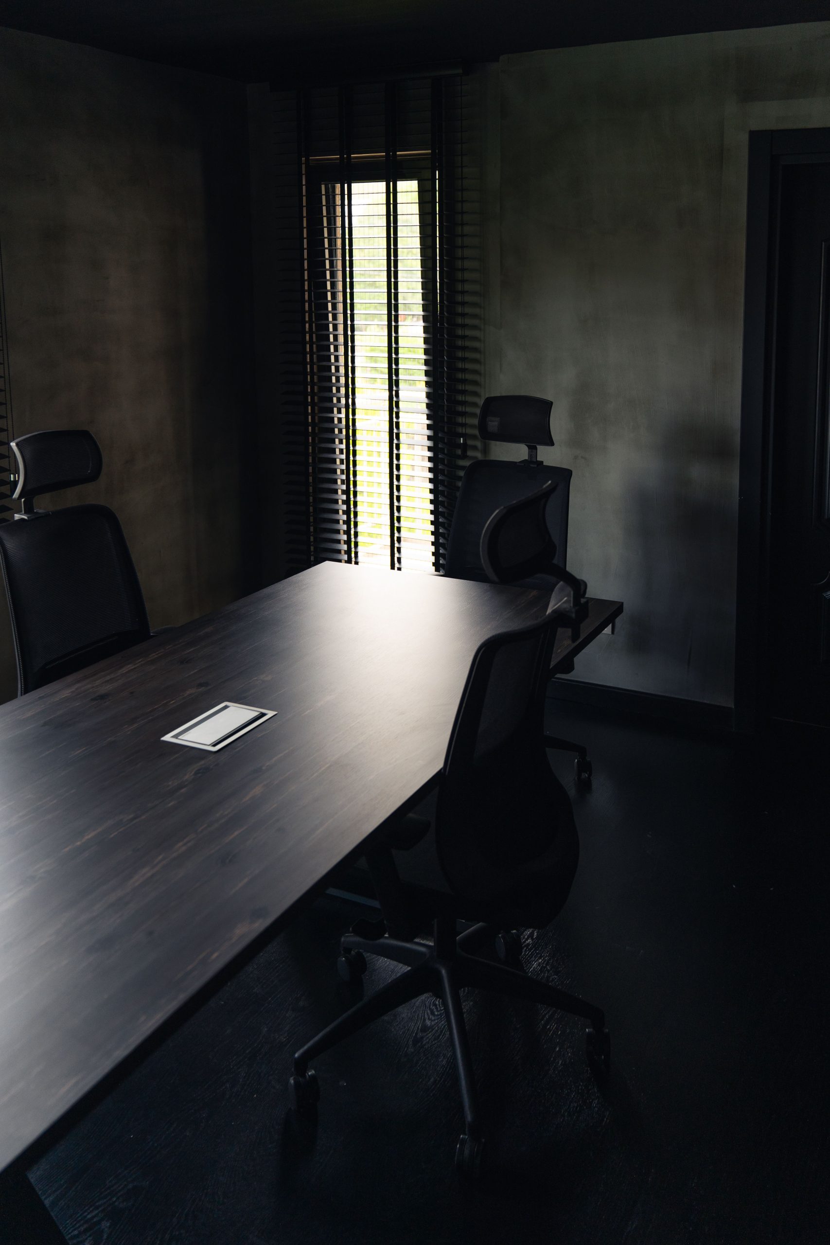 Sleek modern office space with black chairs and a table in Istanbul, Türkiye.