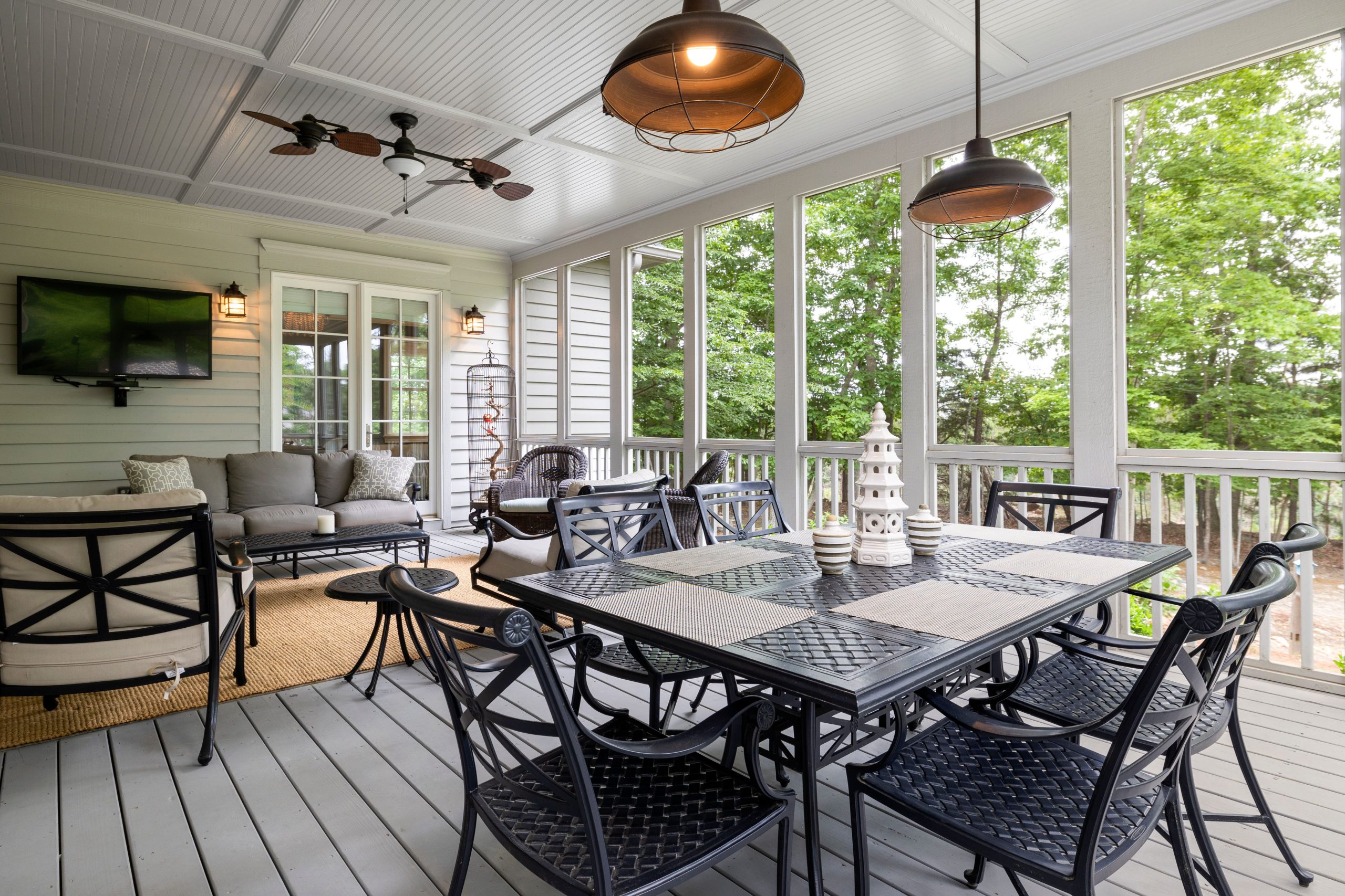 Spacious outdoor patio featuring elegant furniture with a scenic view, perfect for relaxing.