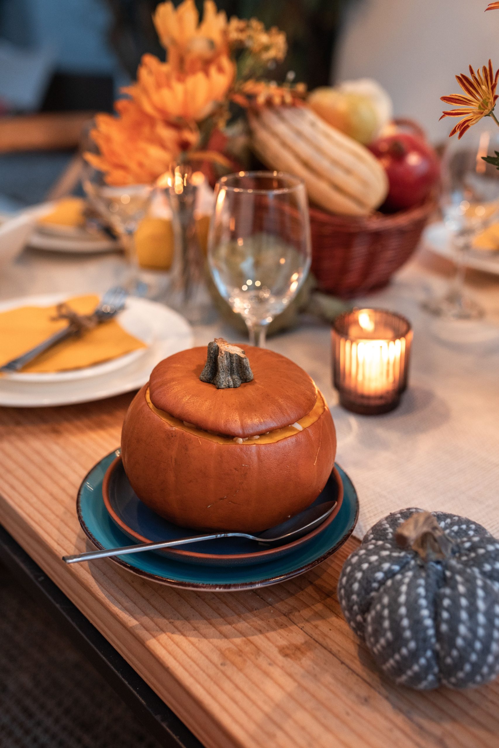 Warm pumpkin-themed table setup perfect for fall gatherings and meals.