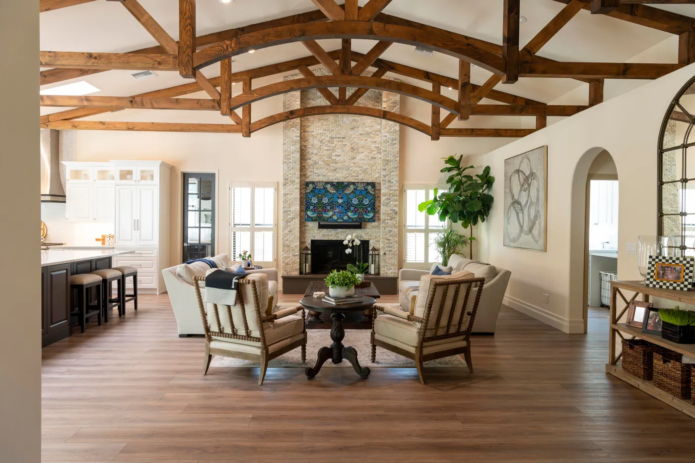 Beautiful living room with luxurious furniture and wooden beams, perfect for cozy gatherings.