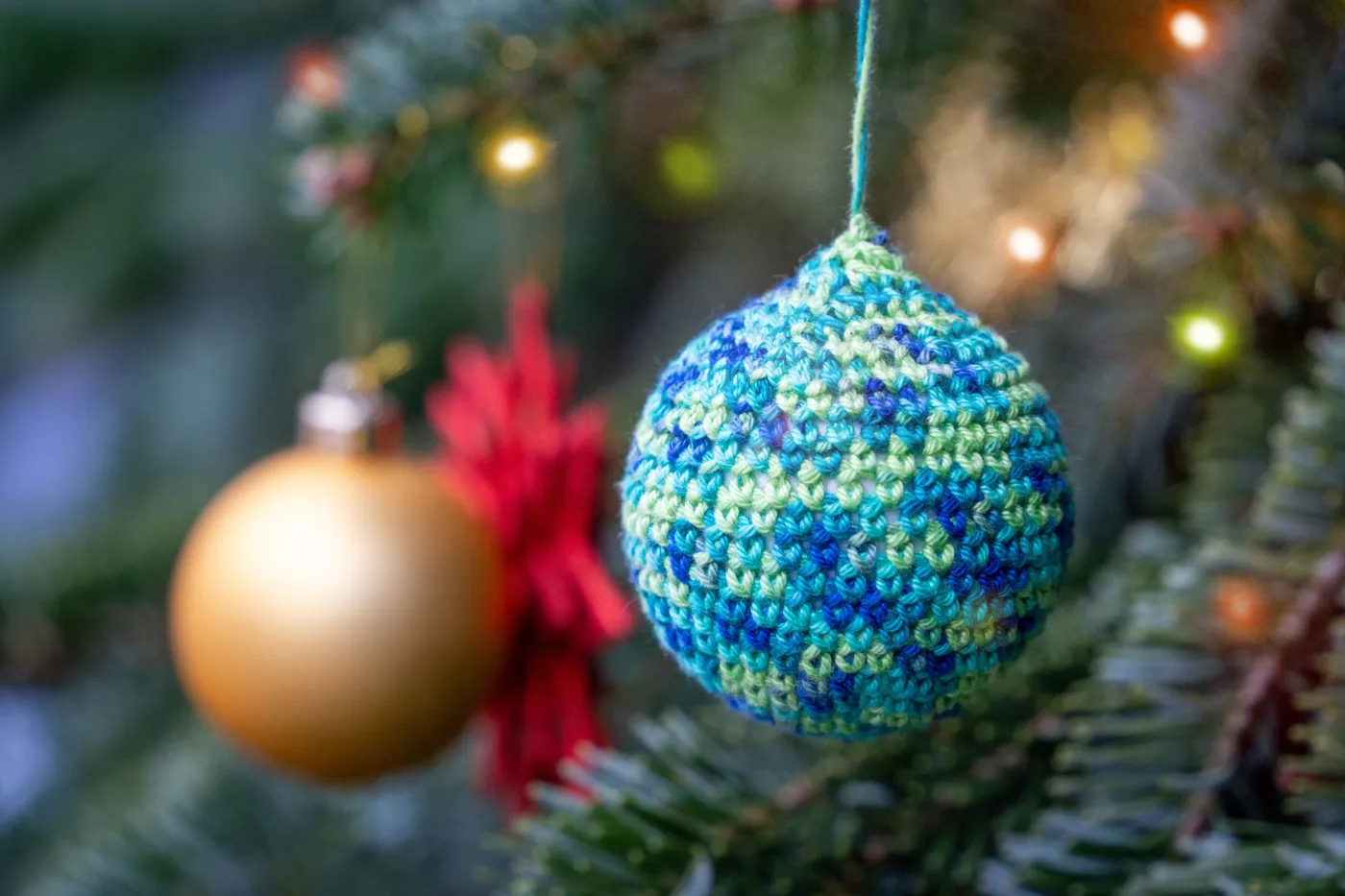 Colorful handmade decorations add charm to a festive Christmas tree.