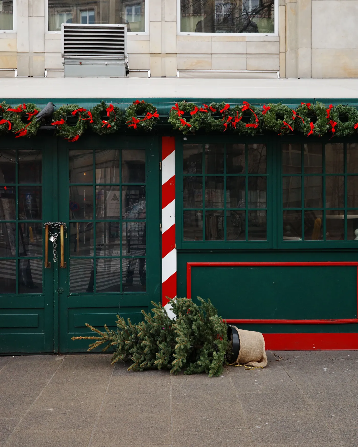 Exterior with green doors and Christmas decorations in Warsaw, Poland.