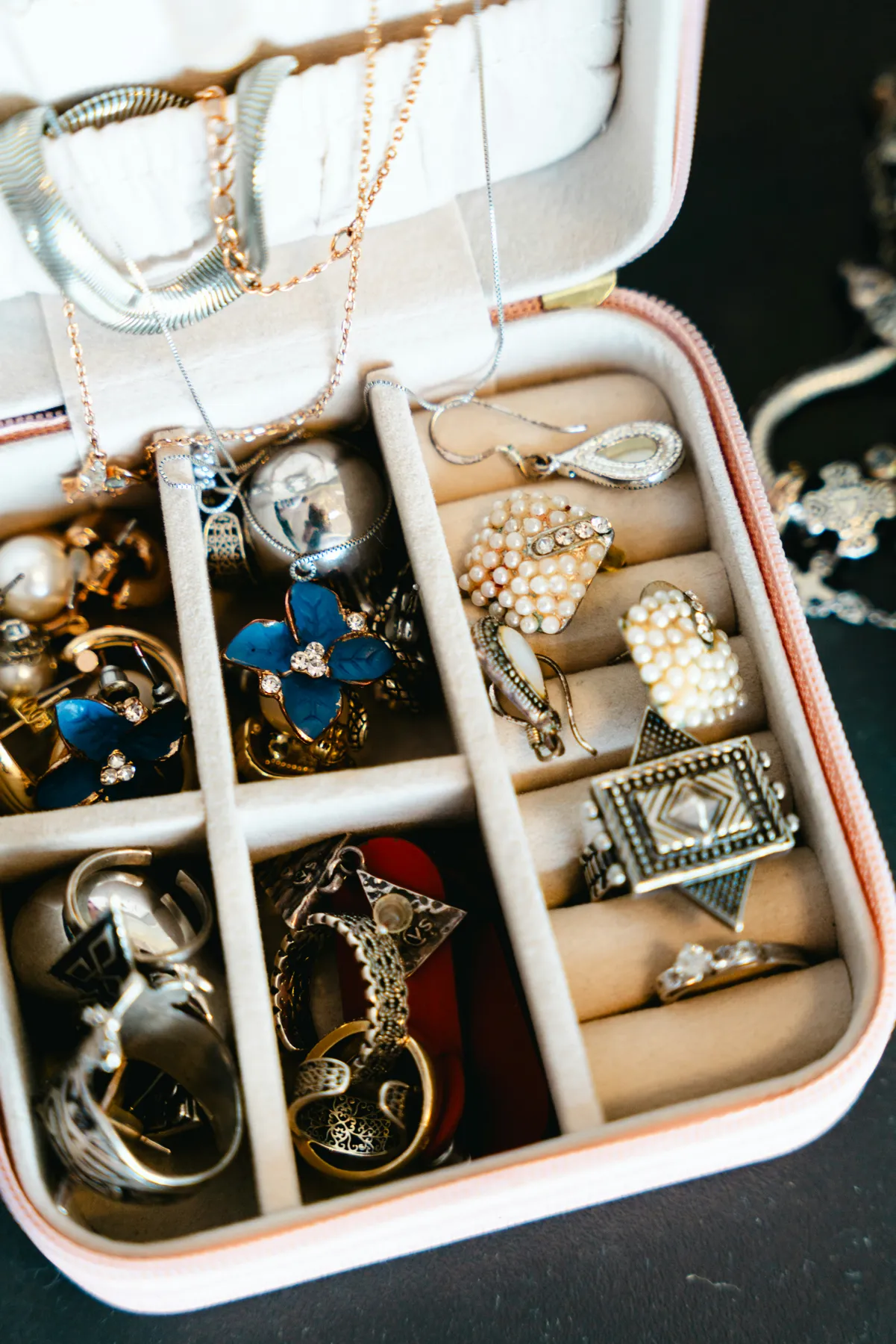 Jewelry box filled with necklaces, rings, and earrings