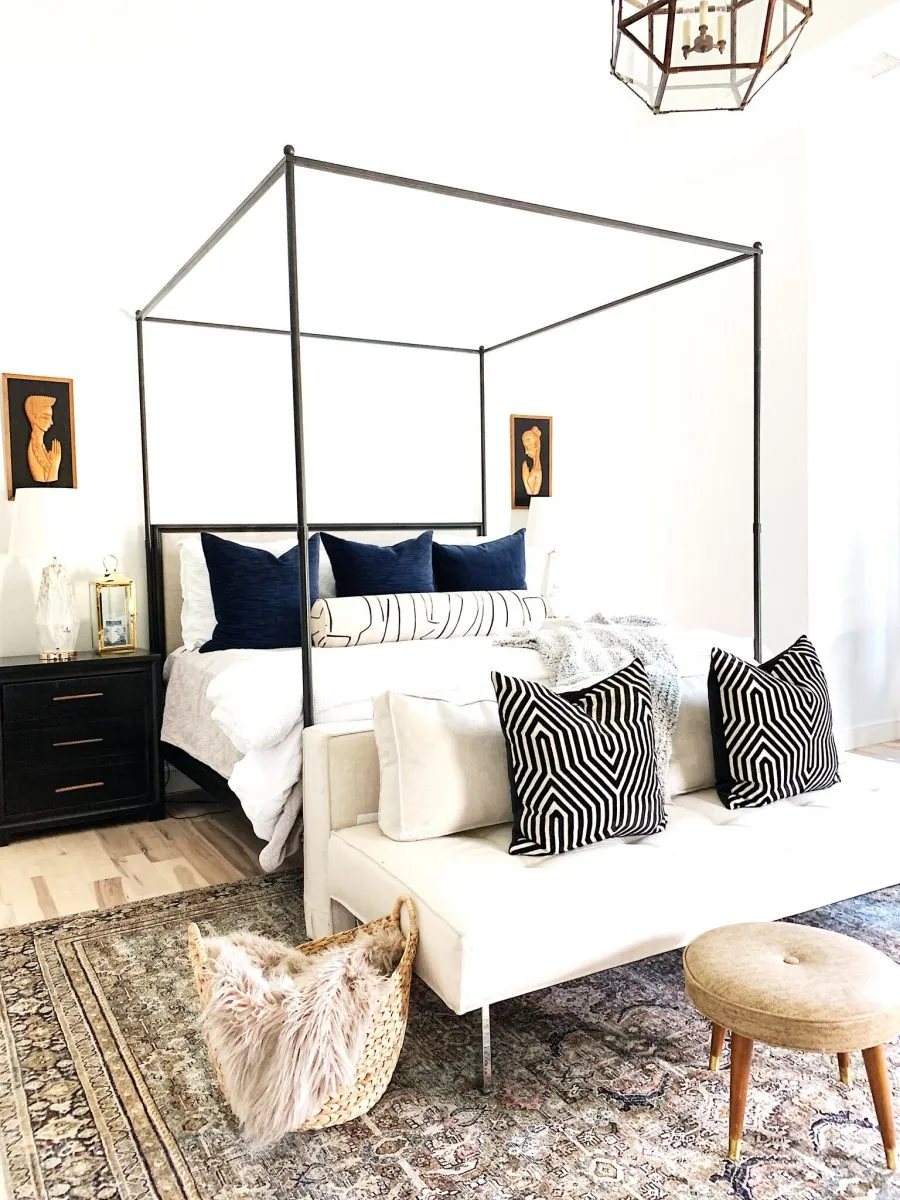 Master Bedroom Design with Walmart Home iron canopy bed with olive charcoal layla rug praying hand arts over black night stands - Carissa Miller Design Co.