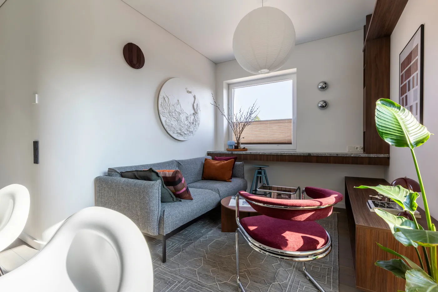 This 35 m² apartment in Vilnius is designed as a compact yet spatially fluid living environment, drawing on Mid-Century modern principles interpreted through a contemporary lens.